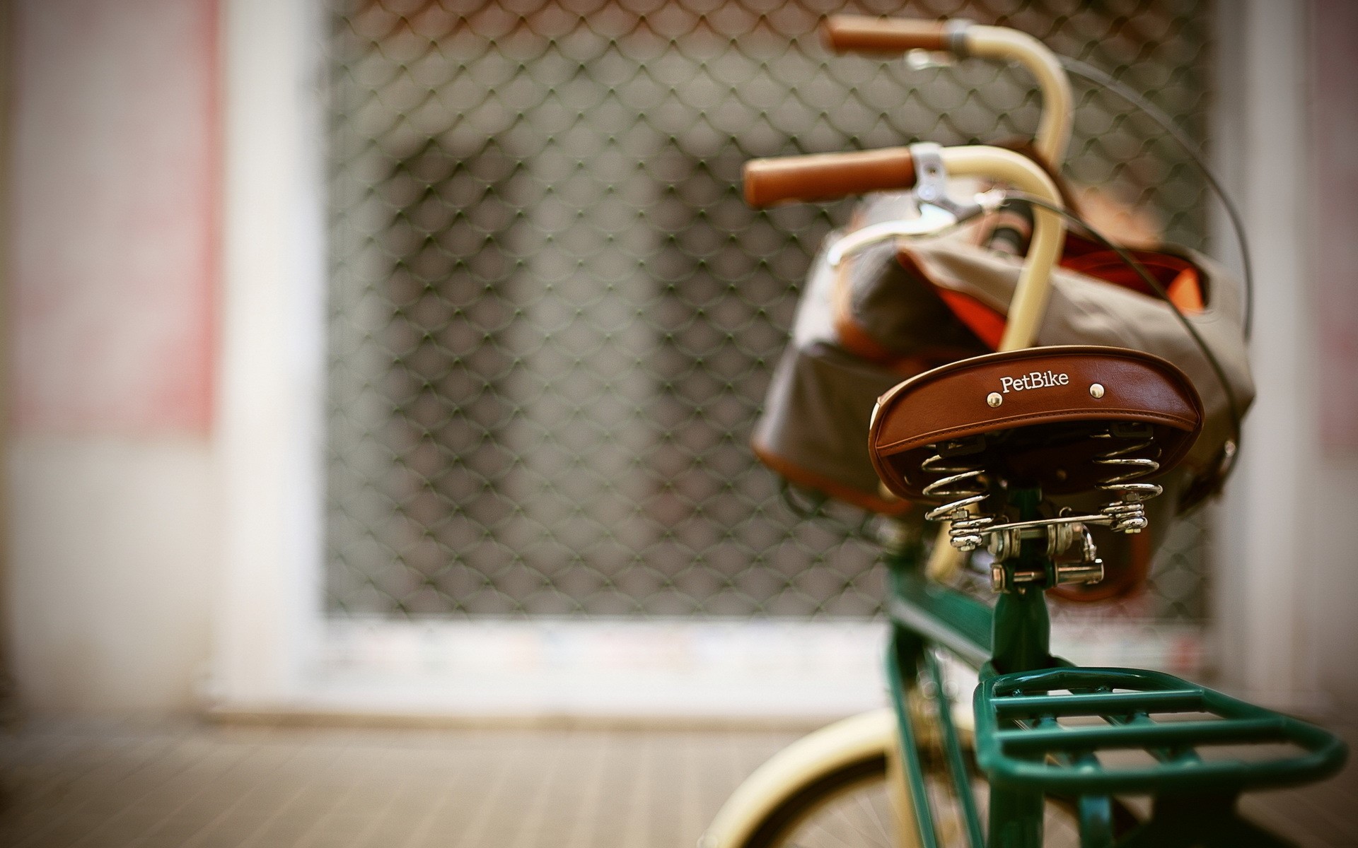 Green bicycle with brown leather seat and basket HD Wallpaper