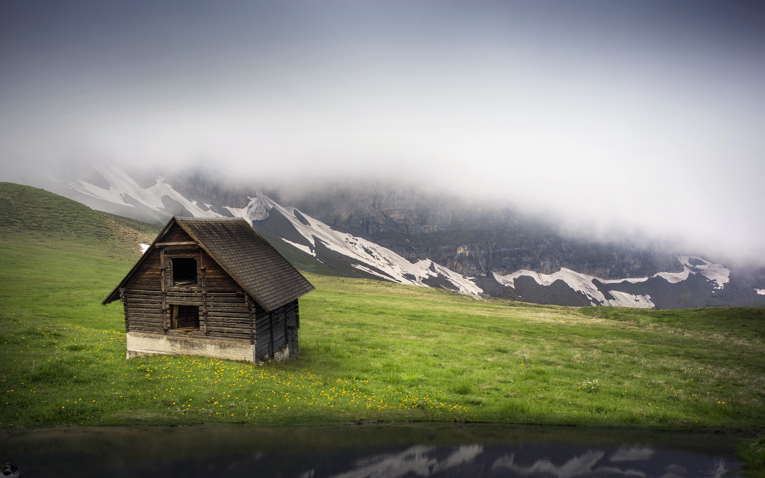 Wooden cabin in foggy mountains with a lake HD Wallpaper