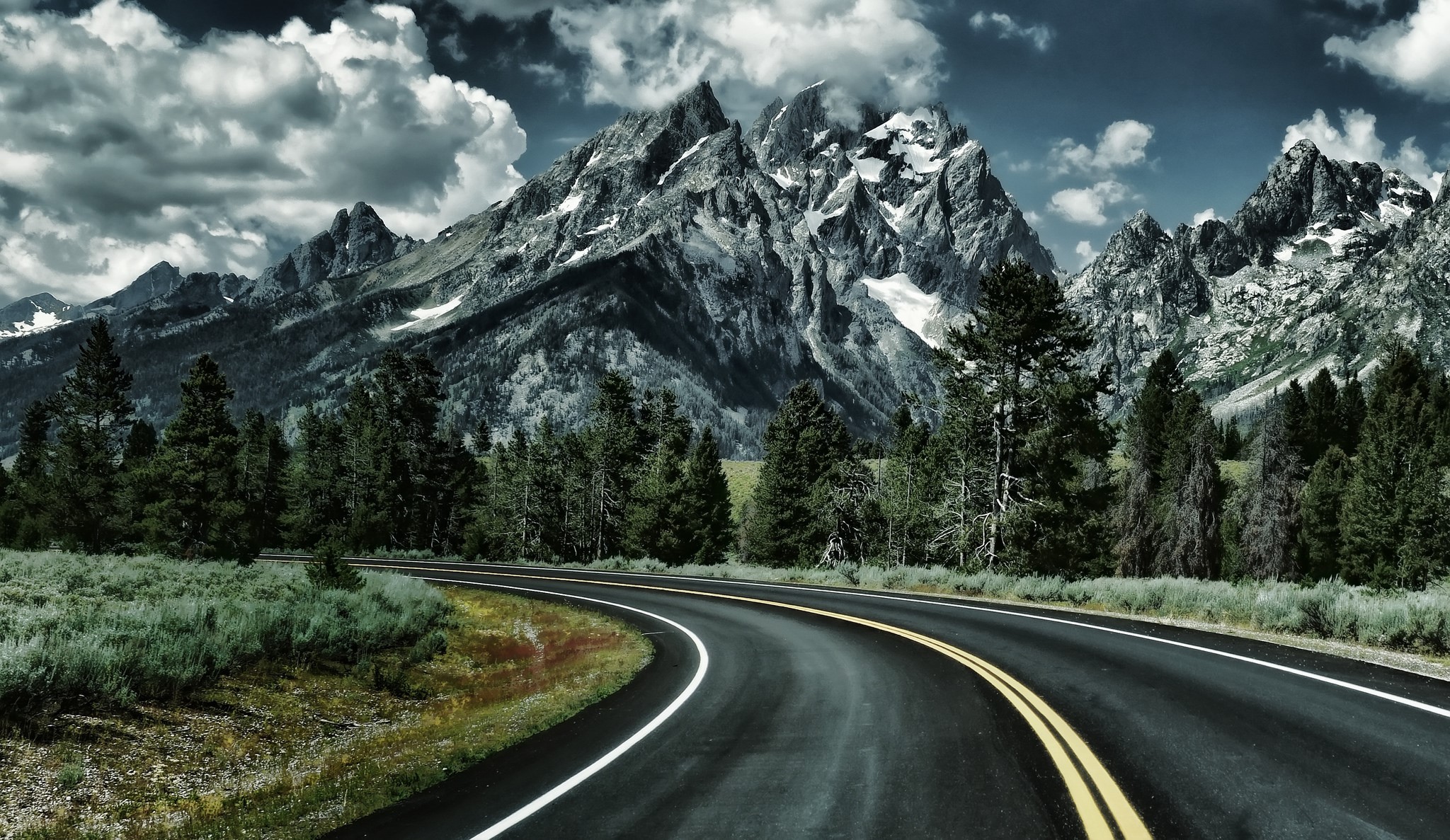 Winding Road Through Mountains and Forest HD Wallpaper
