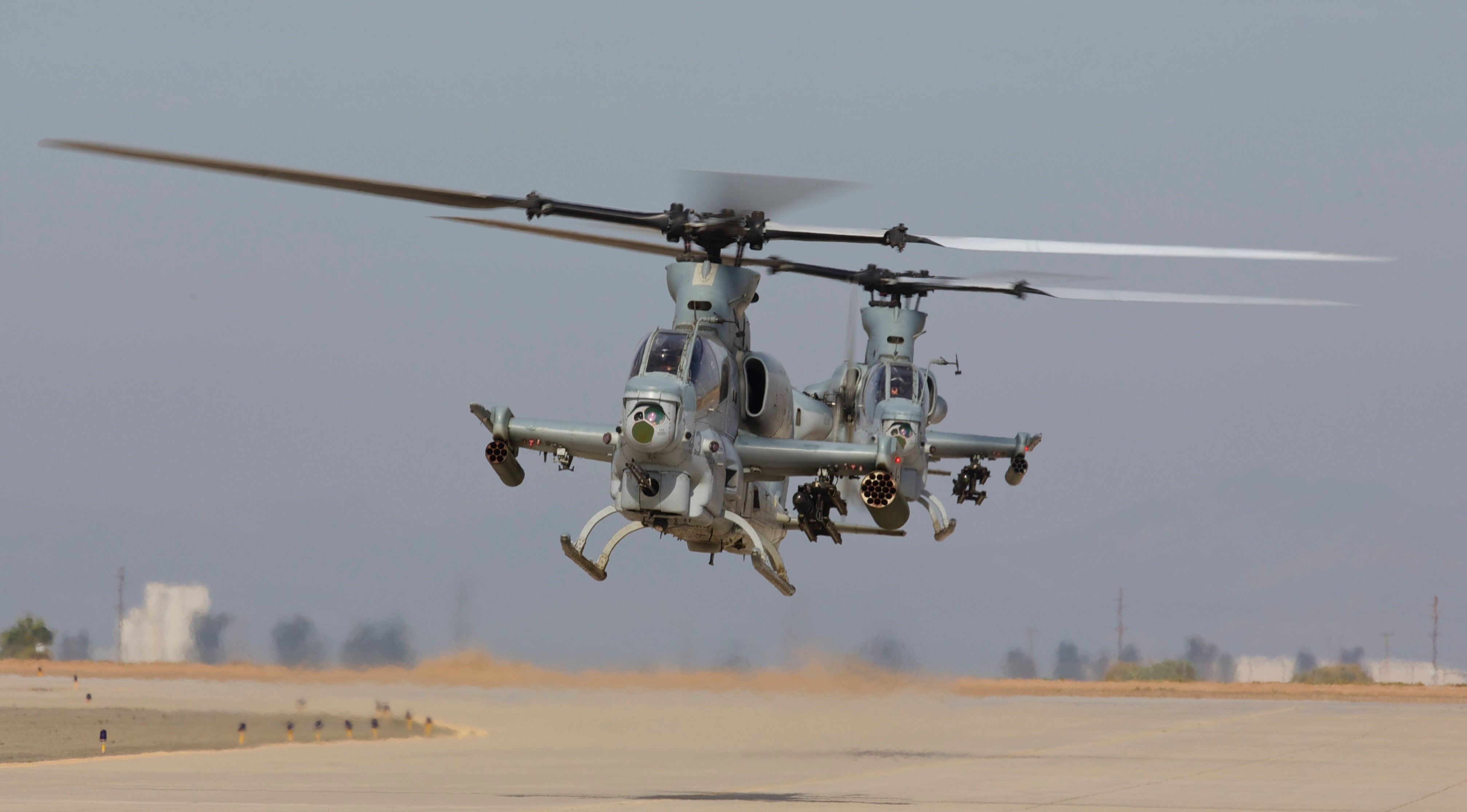 Two AH-1Z Viper helicopters in flight HD Wallpaper