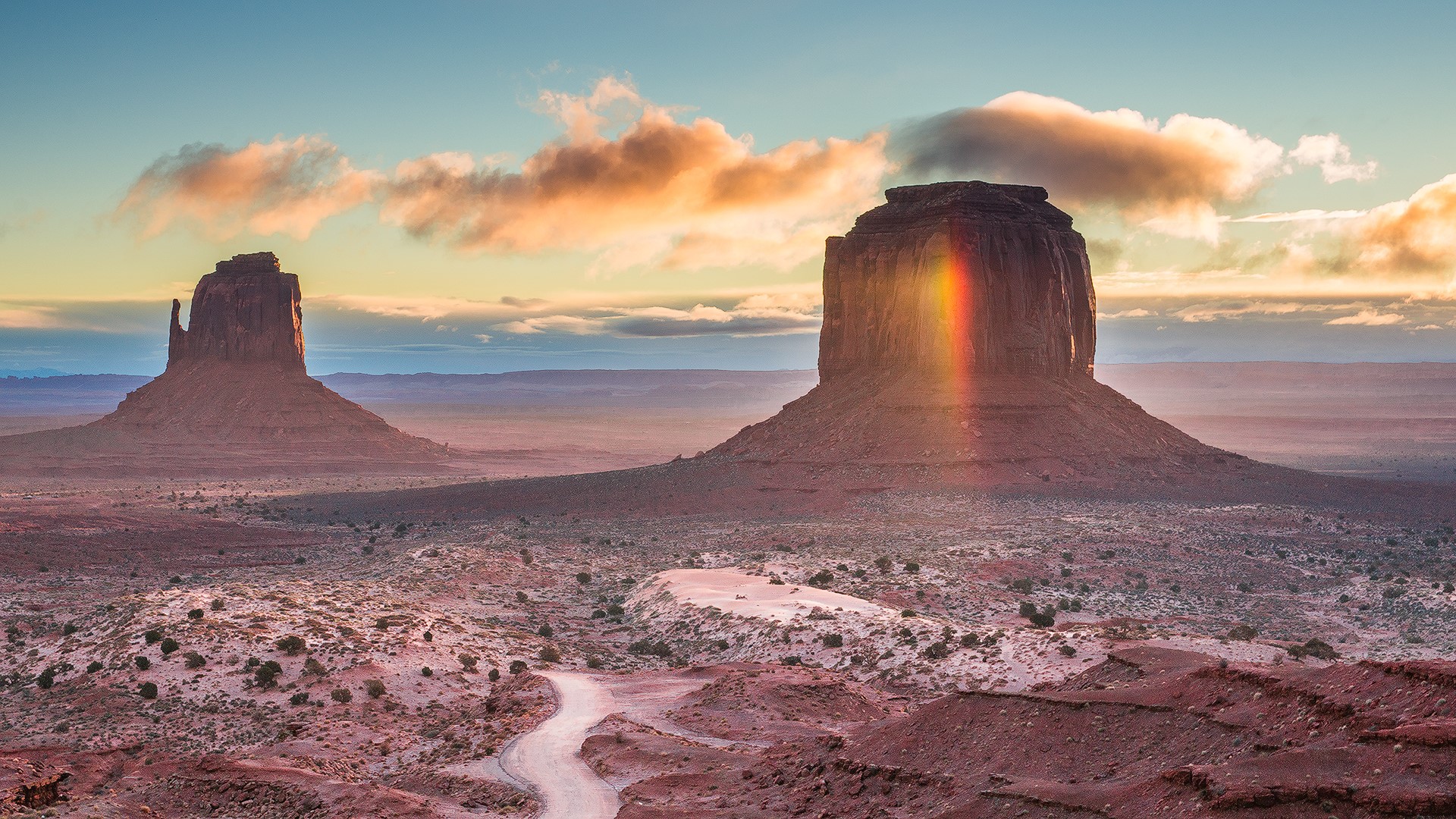 Monument Valley at sunrise with rainbow light HD Wallpaper