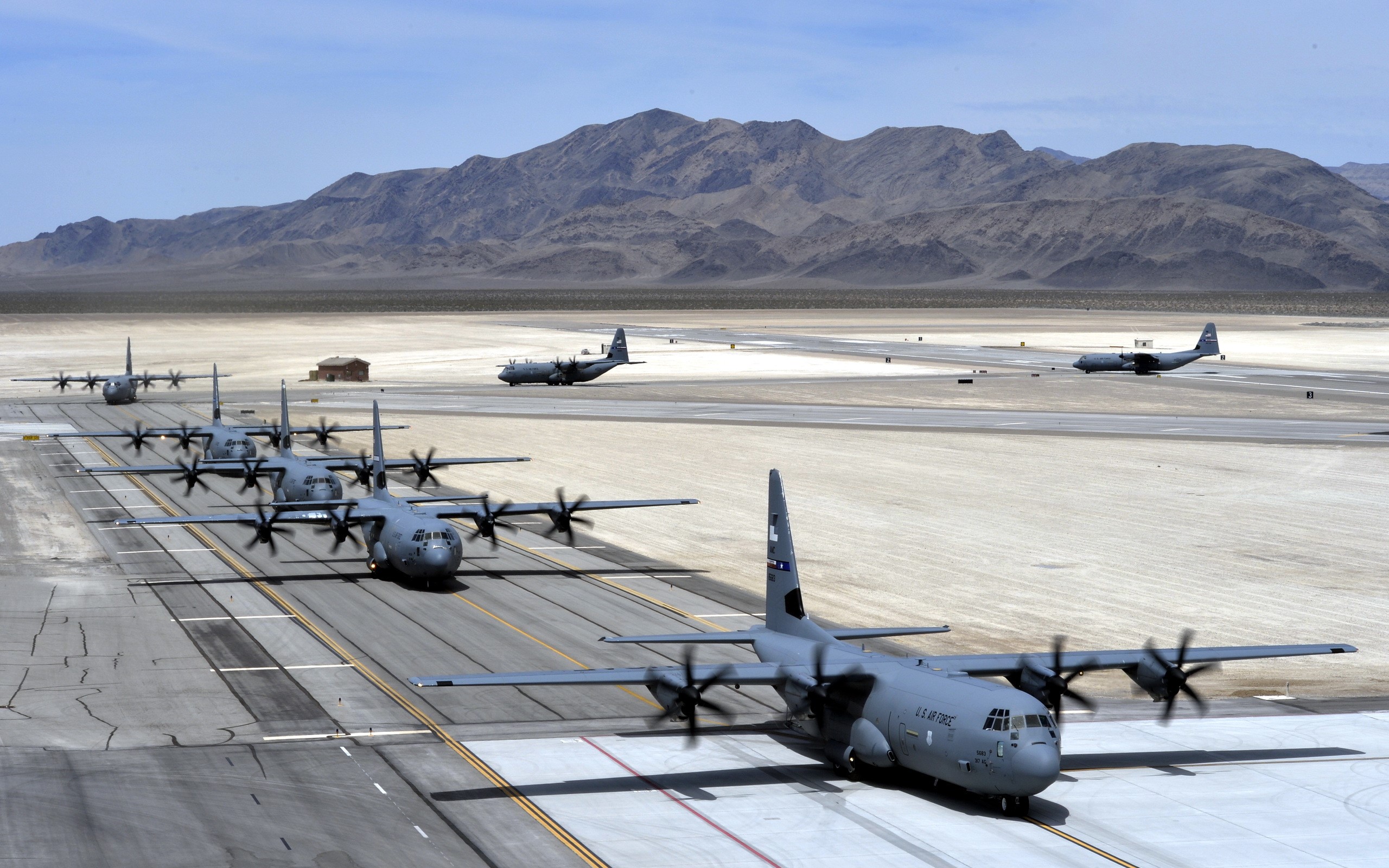 US Air Force C-130J Super Hercules aircraft on runway HD Wallpaper