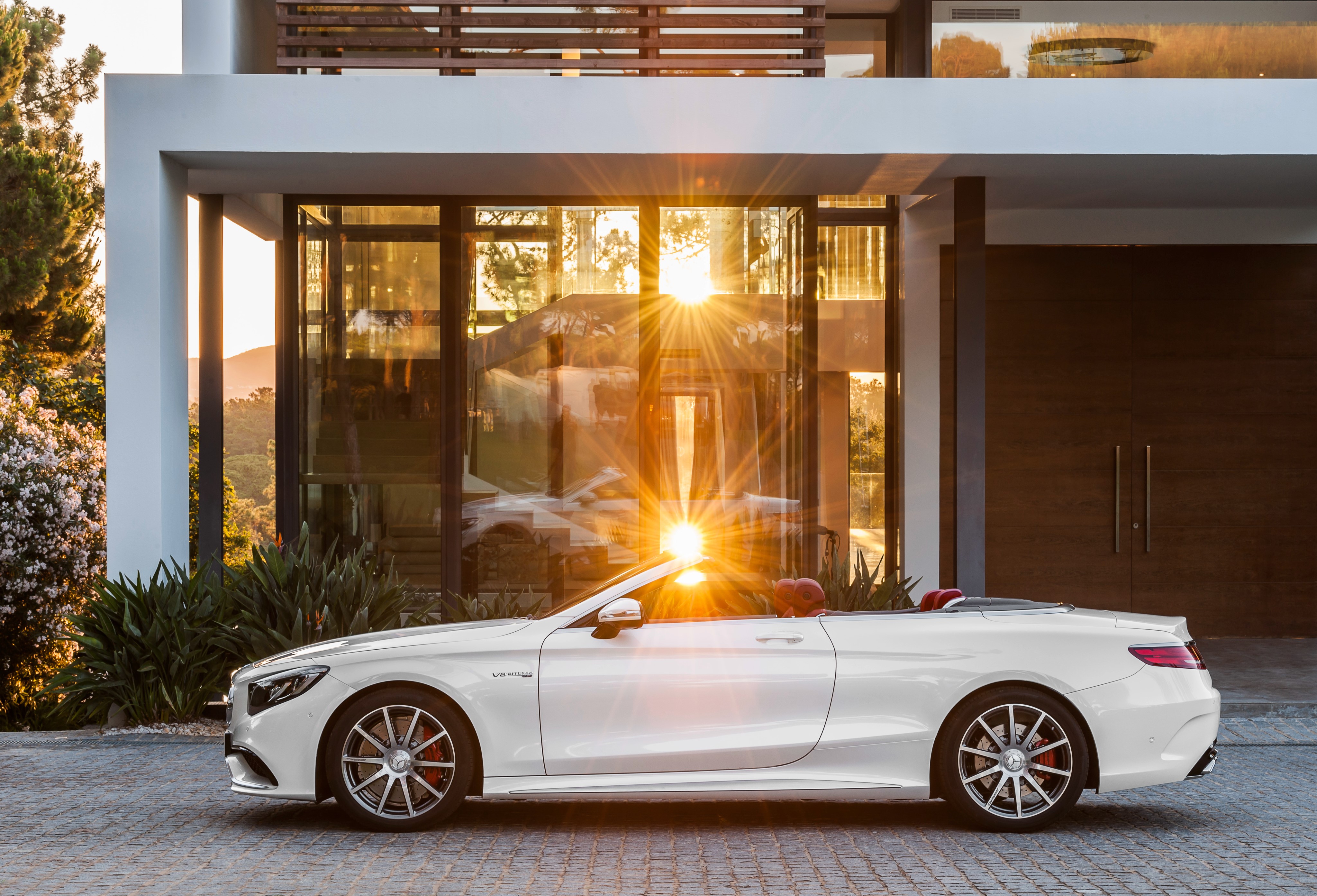 White Mercedes-Benz S 63 Cabriolet parked in front of a modern house HD Wallpaper