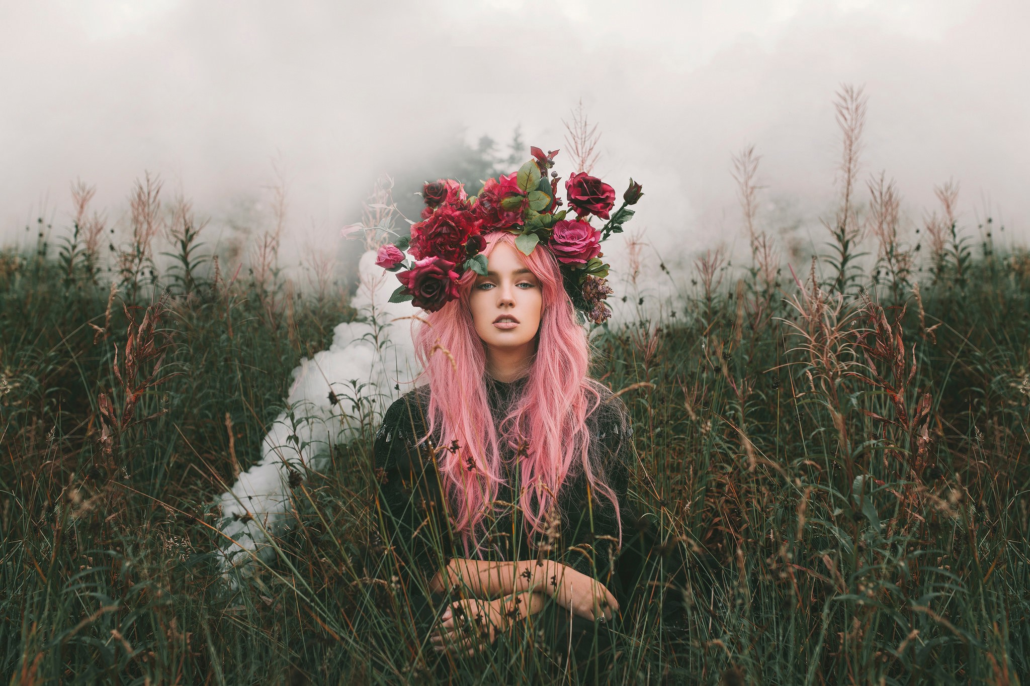 Woman with pink hair and flower crown in grass with smoke HD Wallpaper