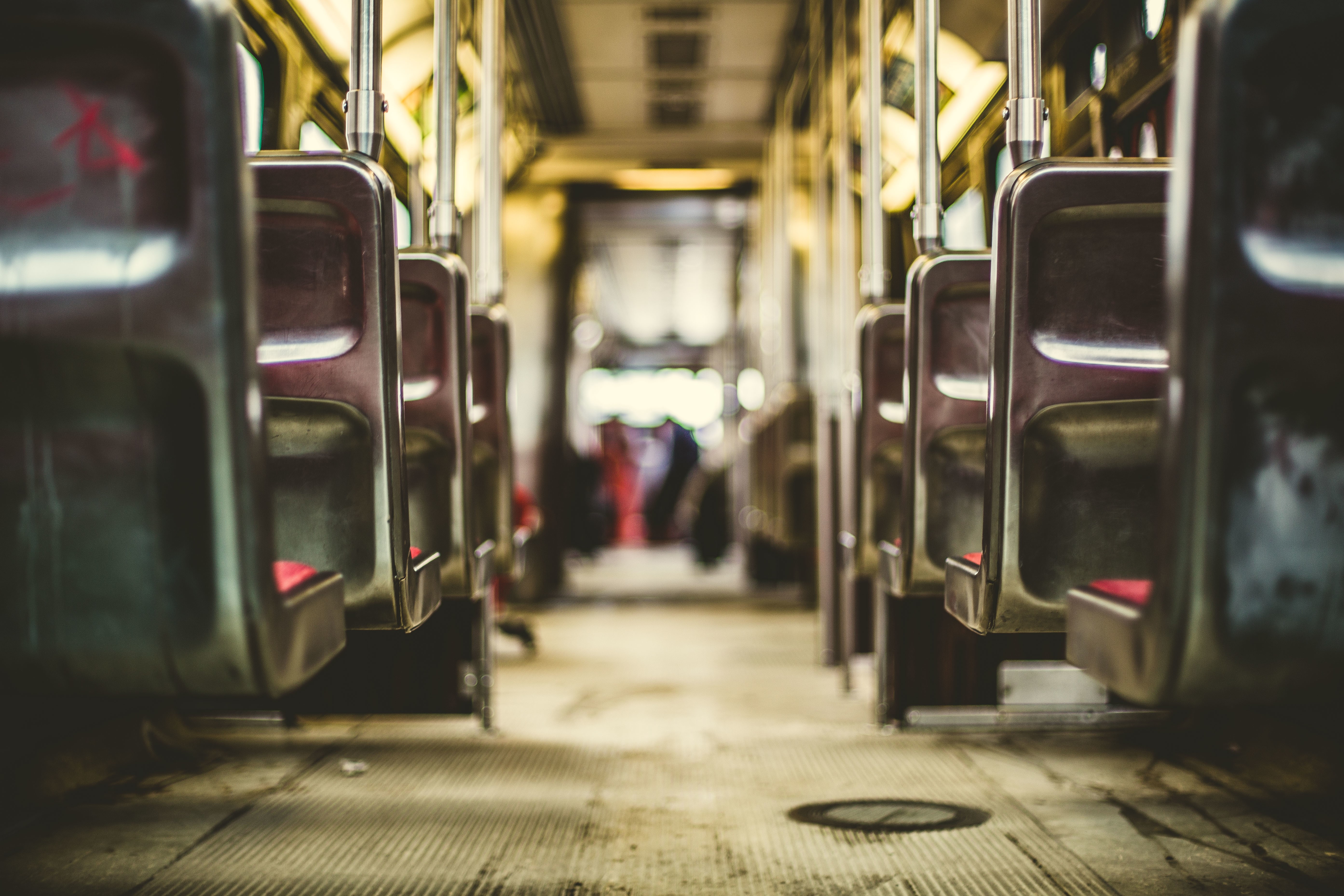 Interior of a tram with empty seats HD Wallpaper