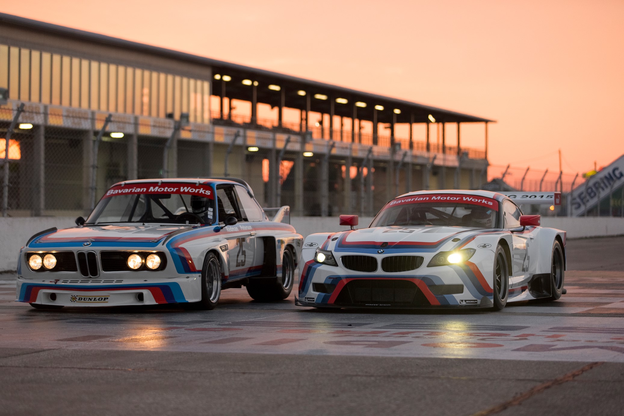 BMW Z4 GTLM and 3.0 CSL race cars at sunset HD Wallpaper