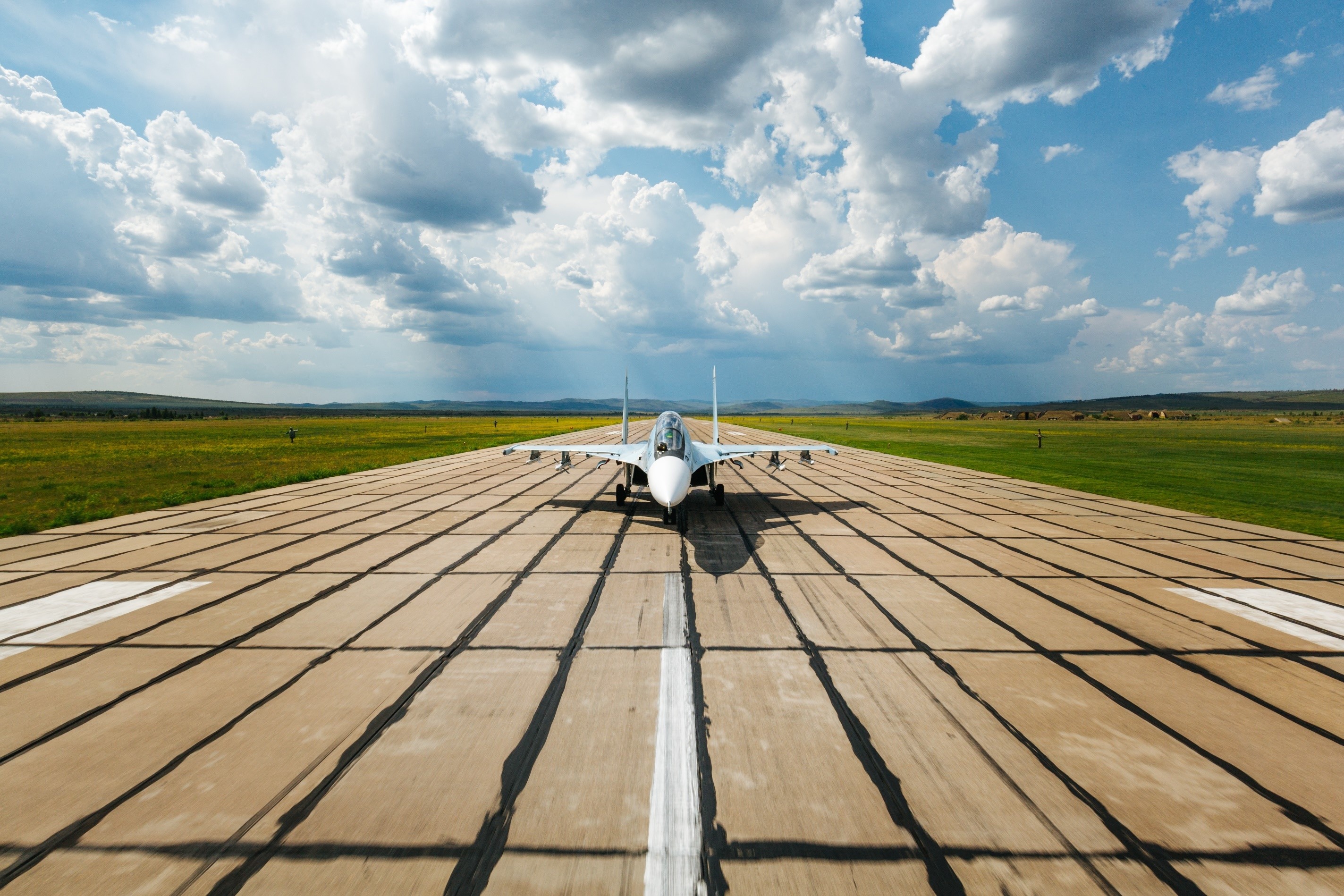 Sukhoi Su-30 fighter jet on a runway HD Wallpaper