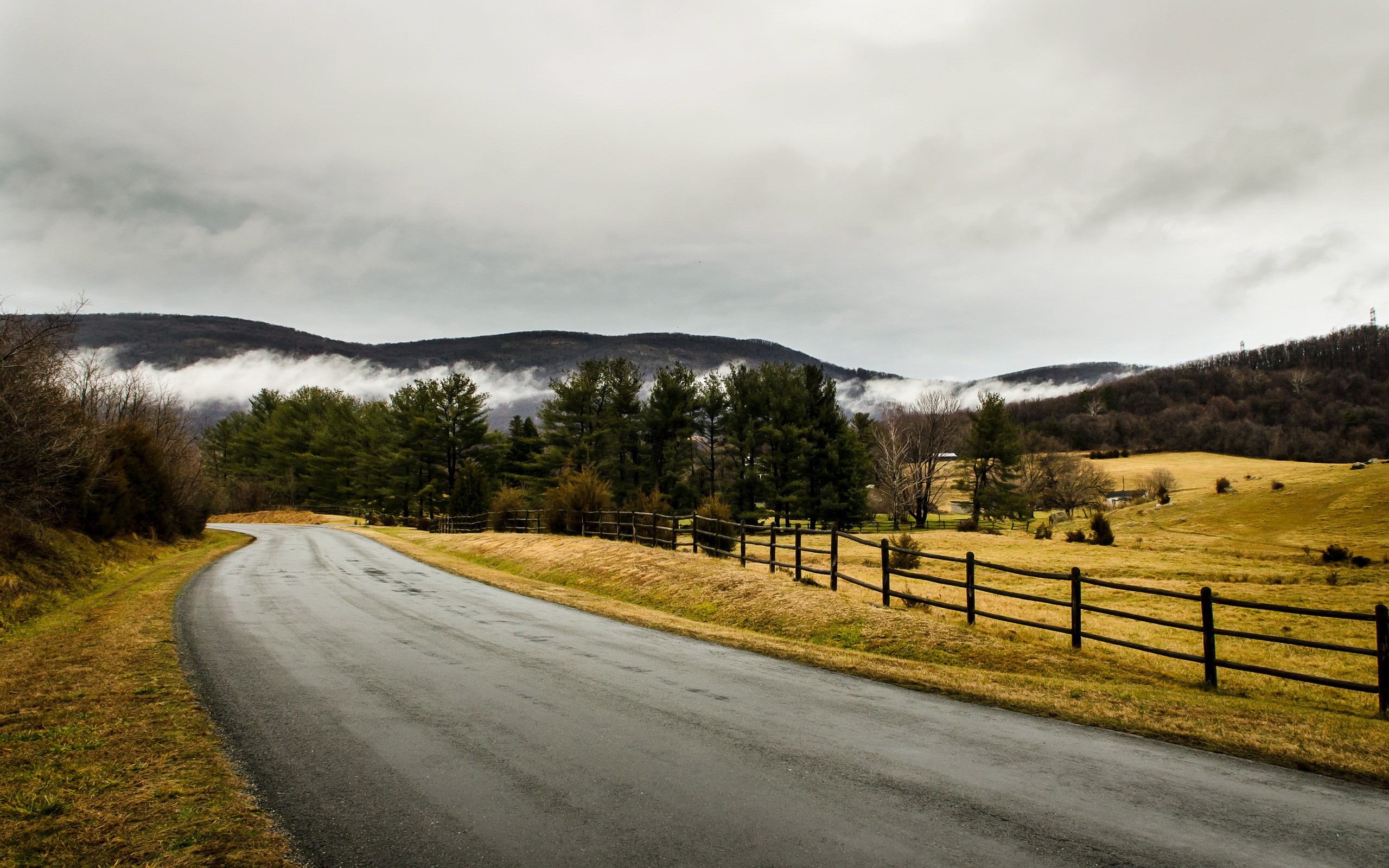 Winding Road Through Rural Landscape with Mountains HD Wallpaper