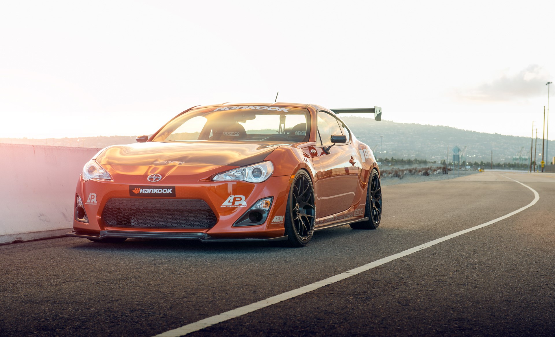 Orange Scion FR-S with a large rear spoiler HD Wallpaper