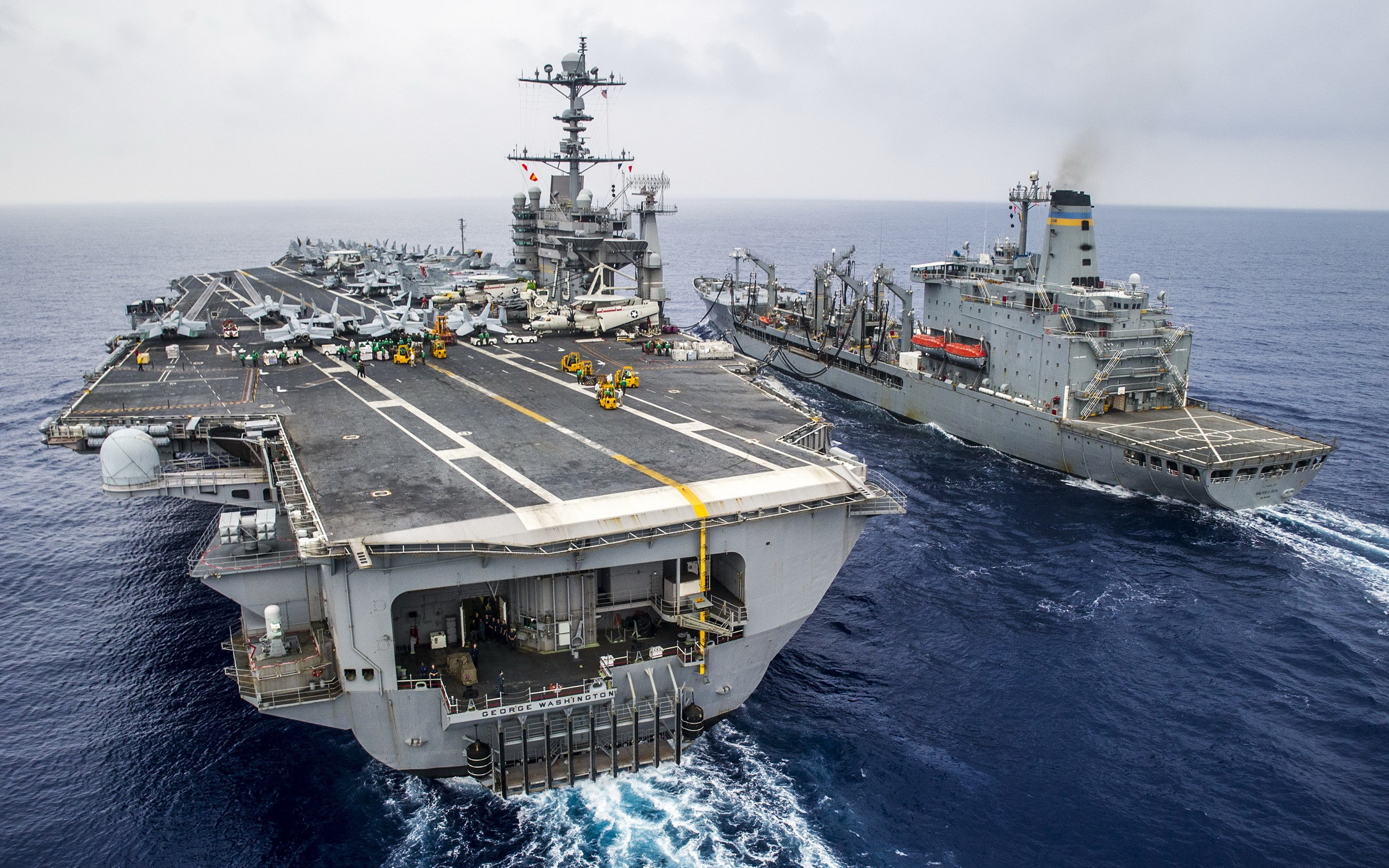USS George Washington (CVN 73) and supply ship at sea HD Wallpaper