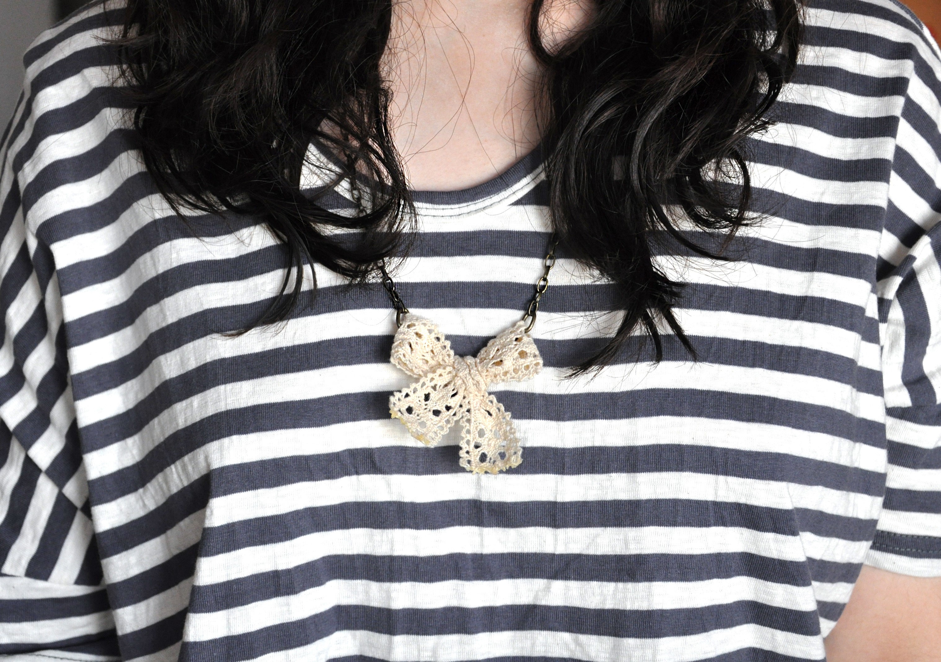 Woman wearing striped shirt and bowknot necklace HD Wallpaper