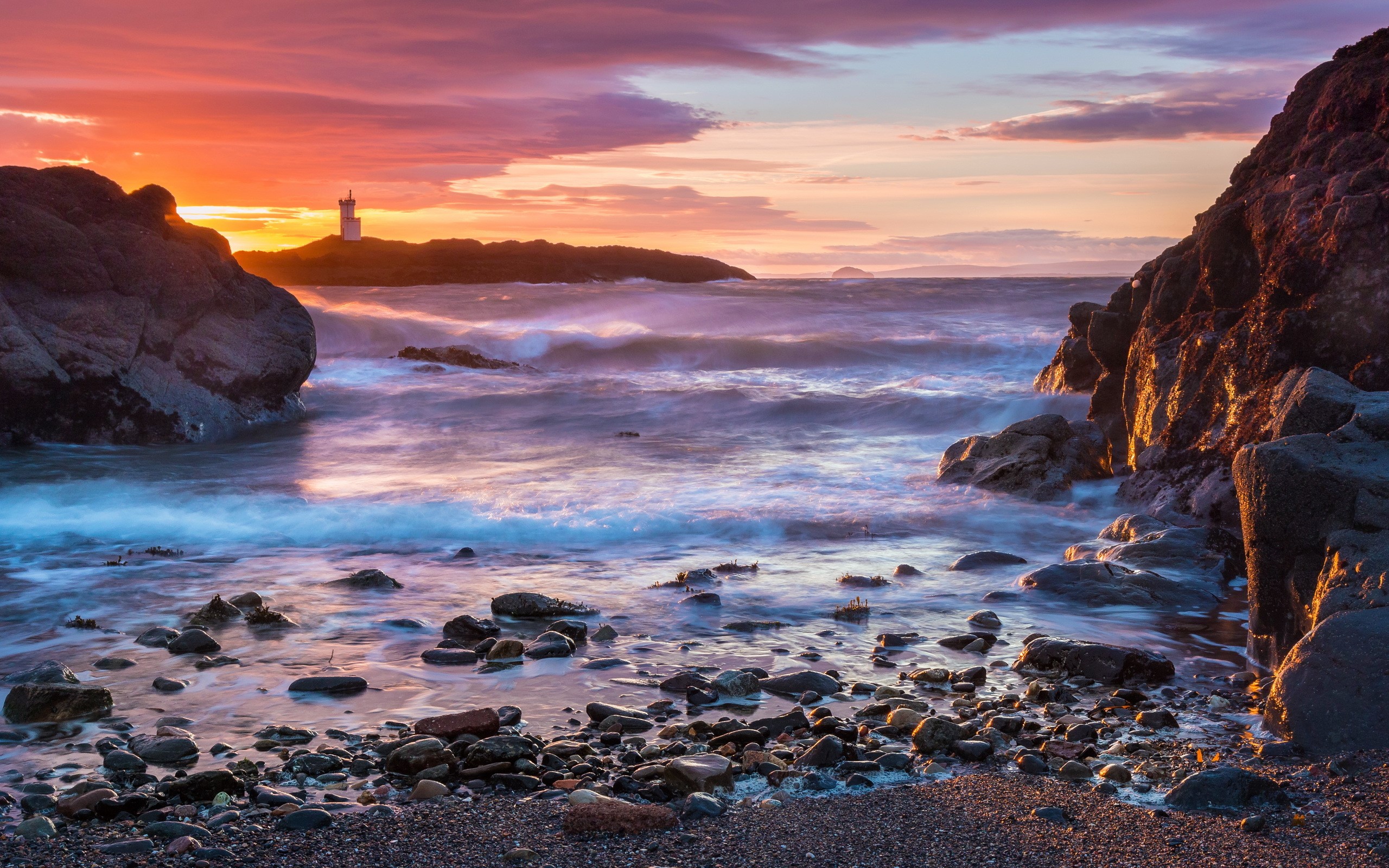 Elie Lighthouse at sunset over the sea with rocks HD Wallpaper