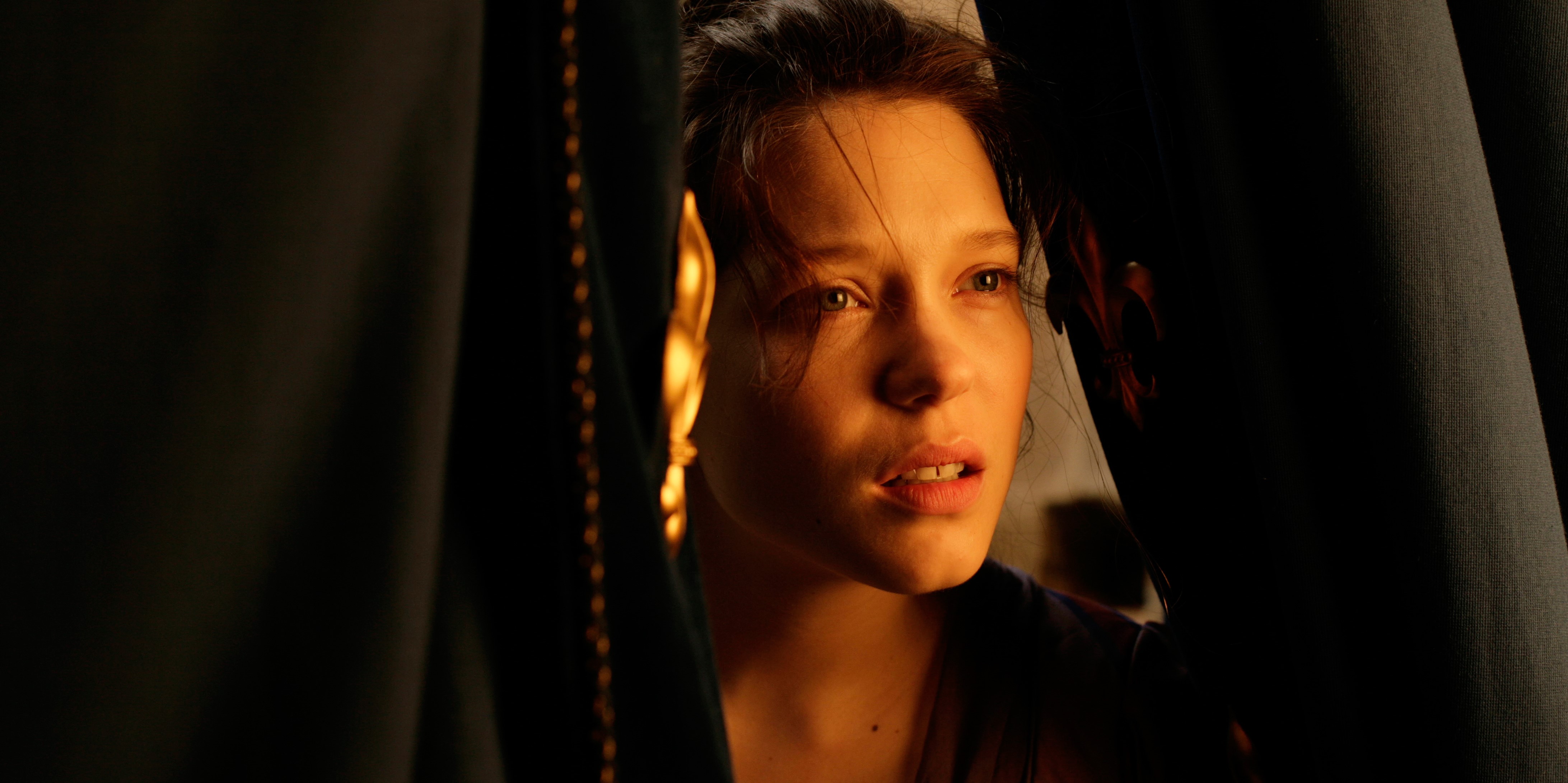 Woman peeking through dark curtains HD Wallpaper