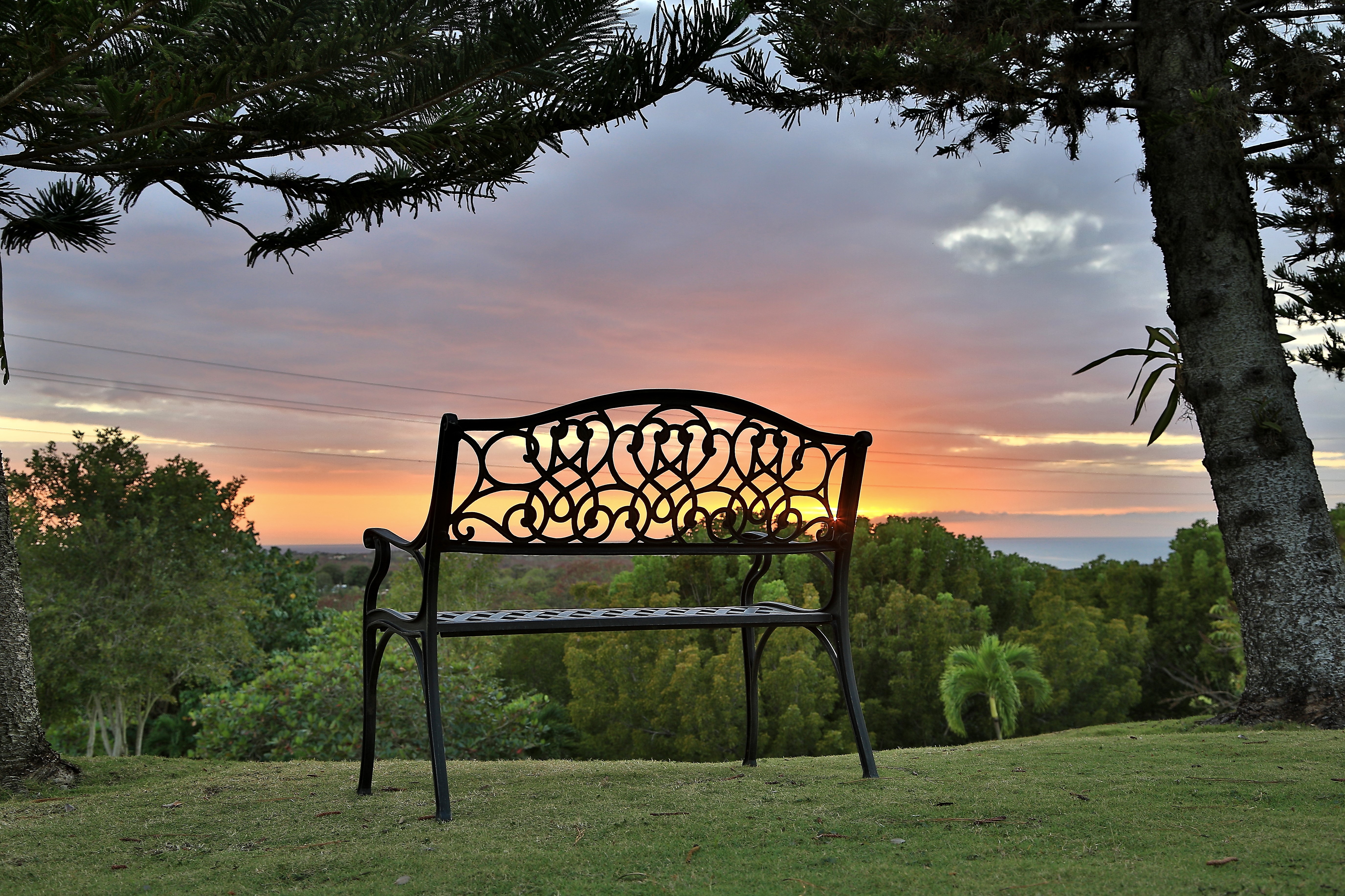 Bench overlooking the ocean at sunset in Cabo Rojo, Puerto Rico HD Wallpaper