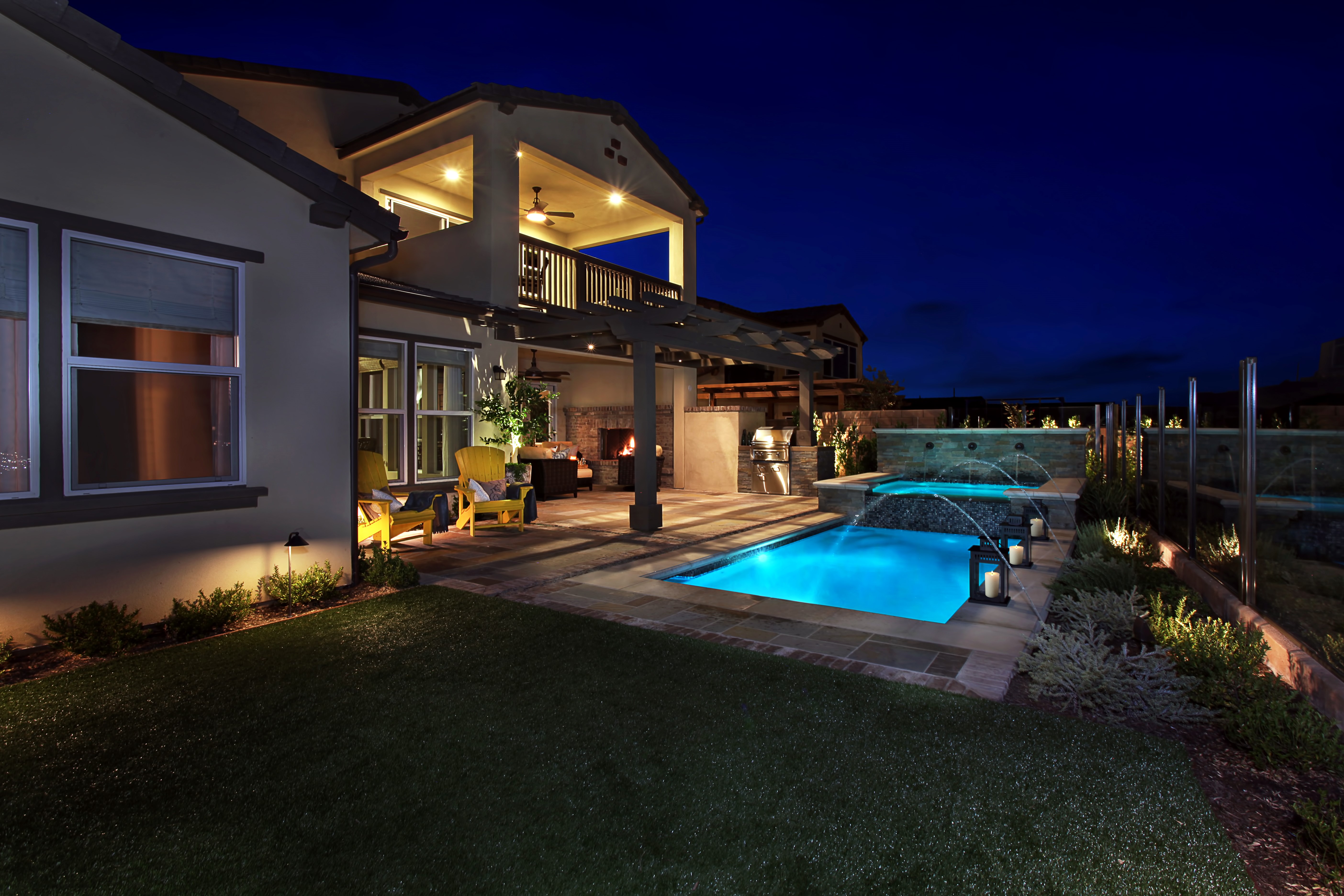 Luxury Backyard with Pool and Outdoor Kitchen at Night HD Wallpaper
