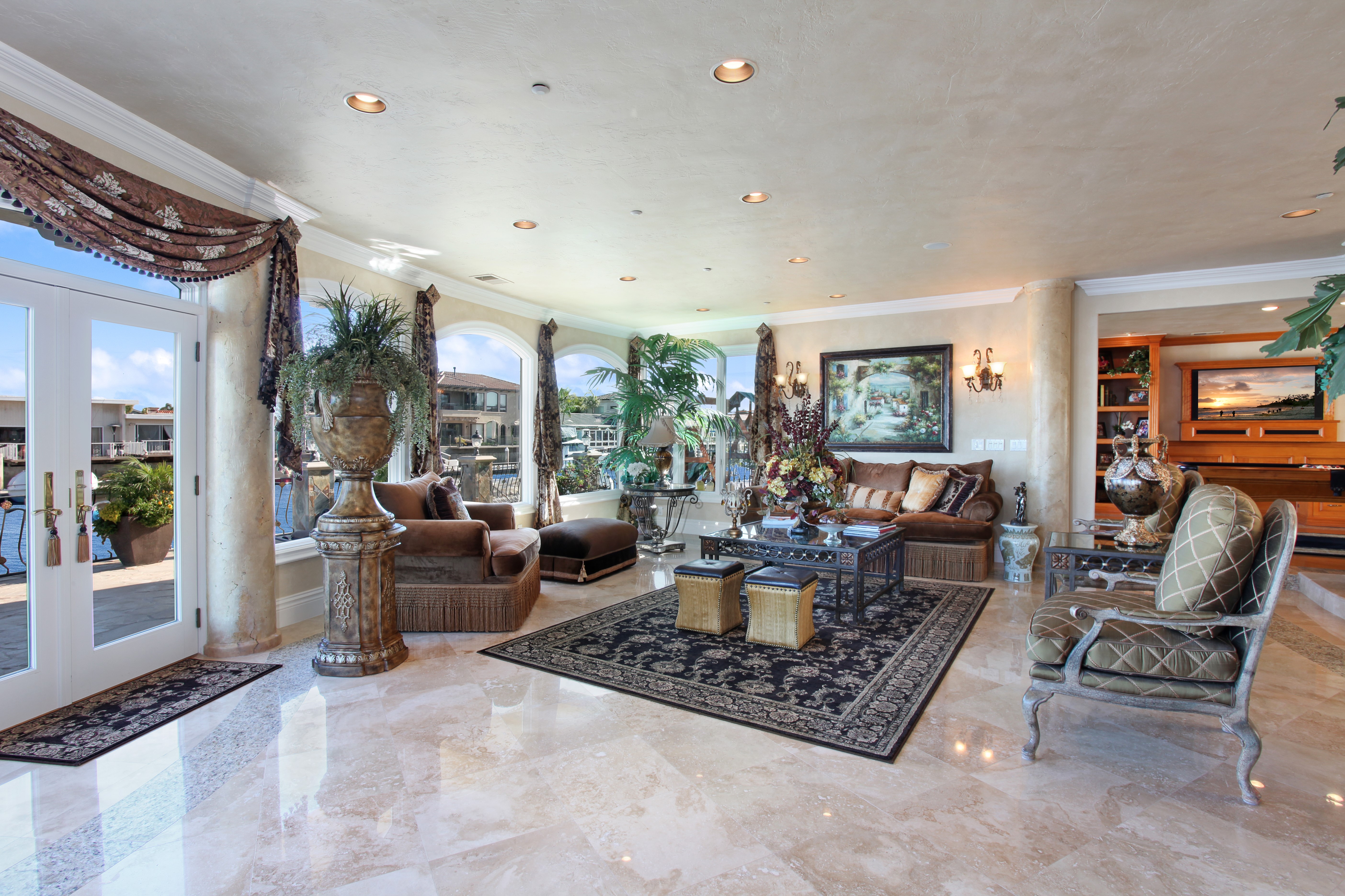 Luxury living room with canal view and ornate furnishings HD Wallpaper