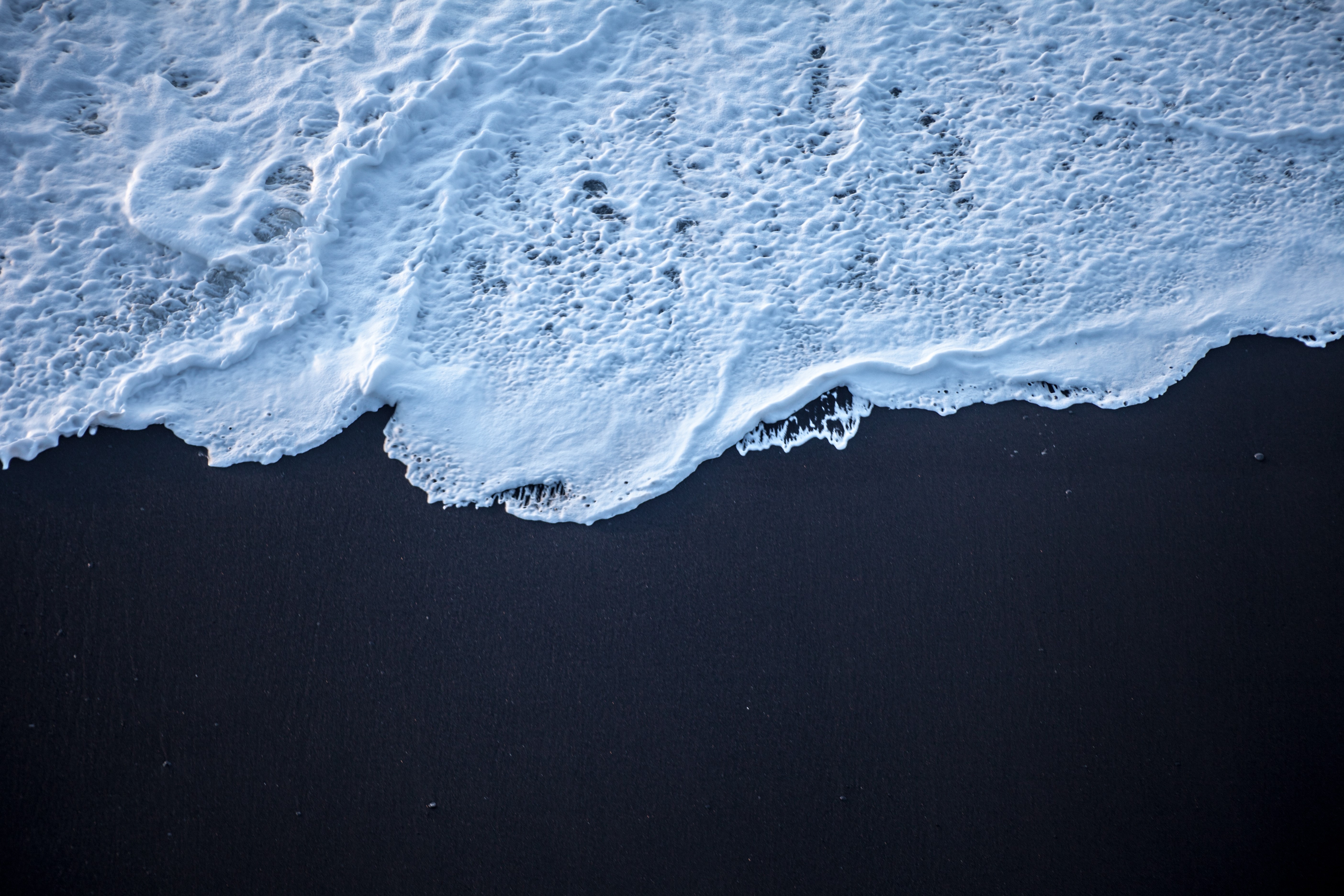 Foam on Black Sand Beach HD Wallpaper