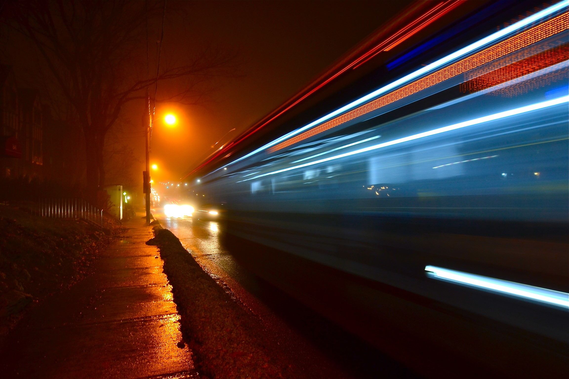 Night street with light trails from moving vehicle HD Wallpaper