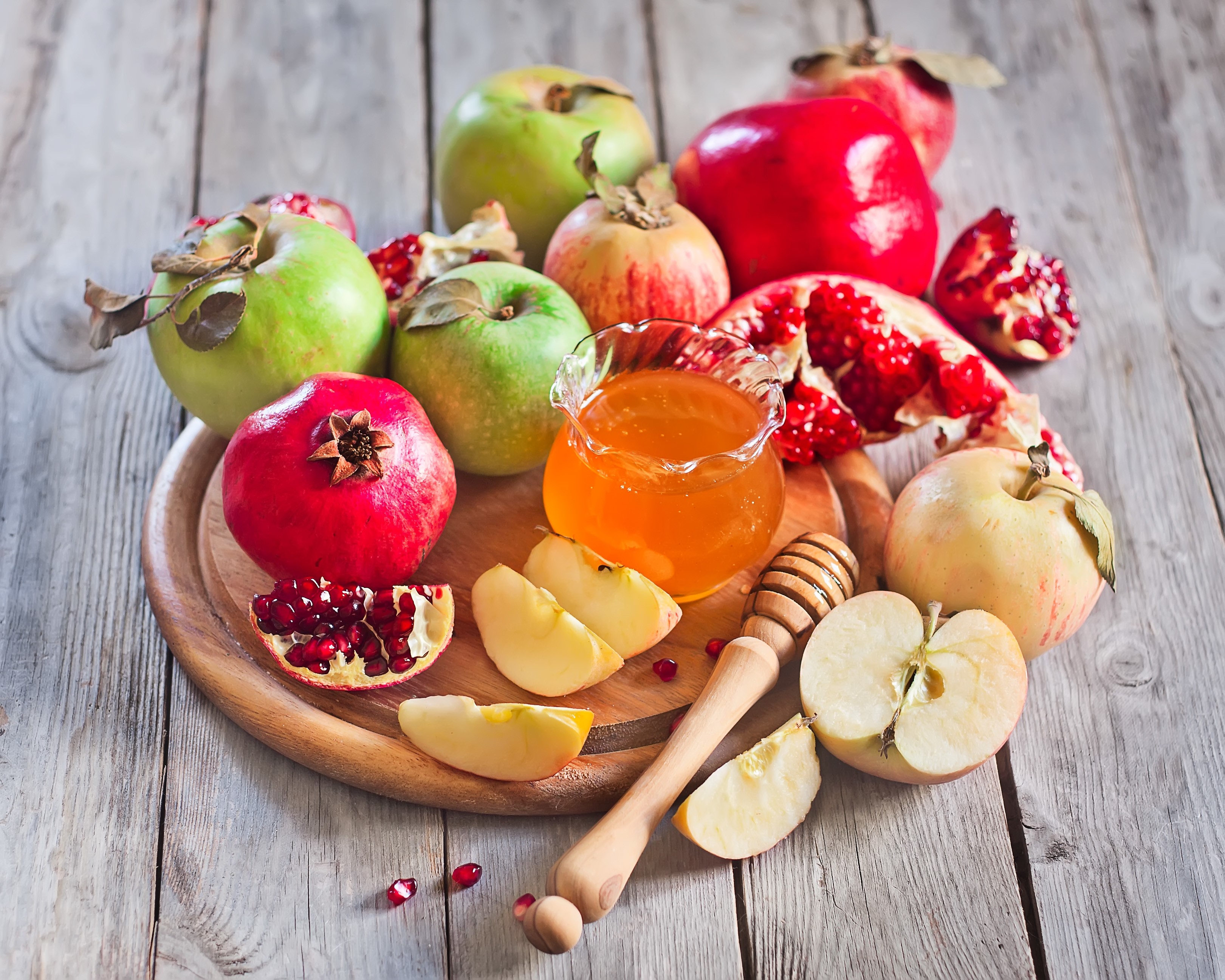 Apples, Pomegranates, and Honey on a Wooden Board HD Wallpaper
