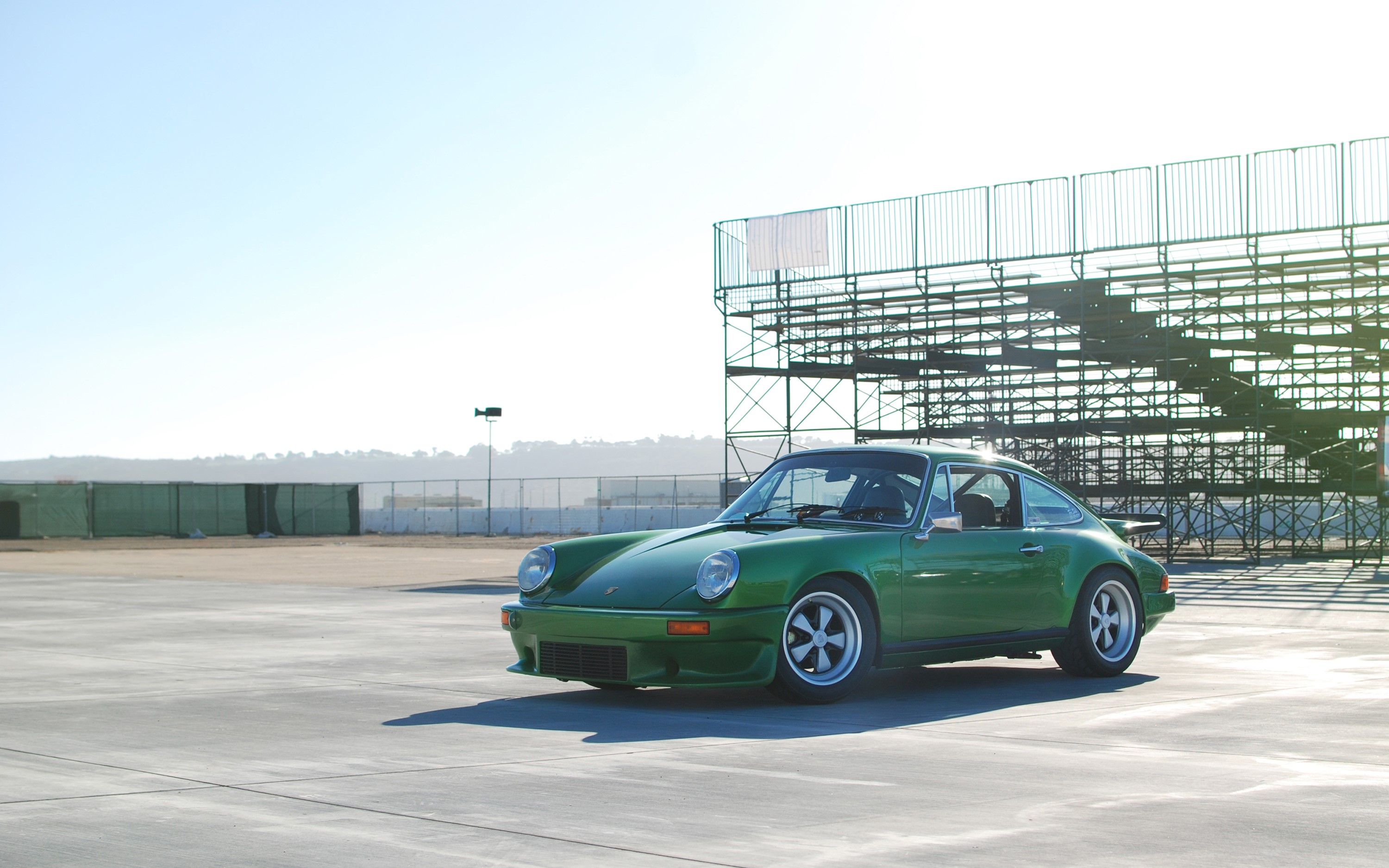 Green vintage Porsche 911 on a track HD Wallpaper