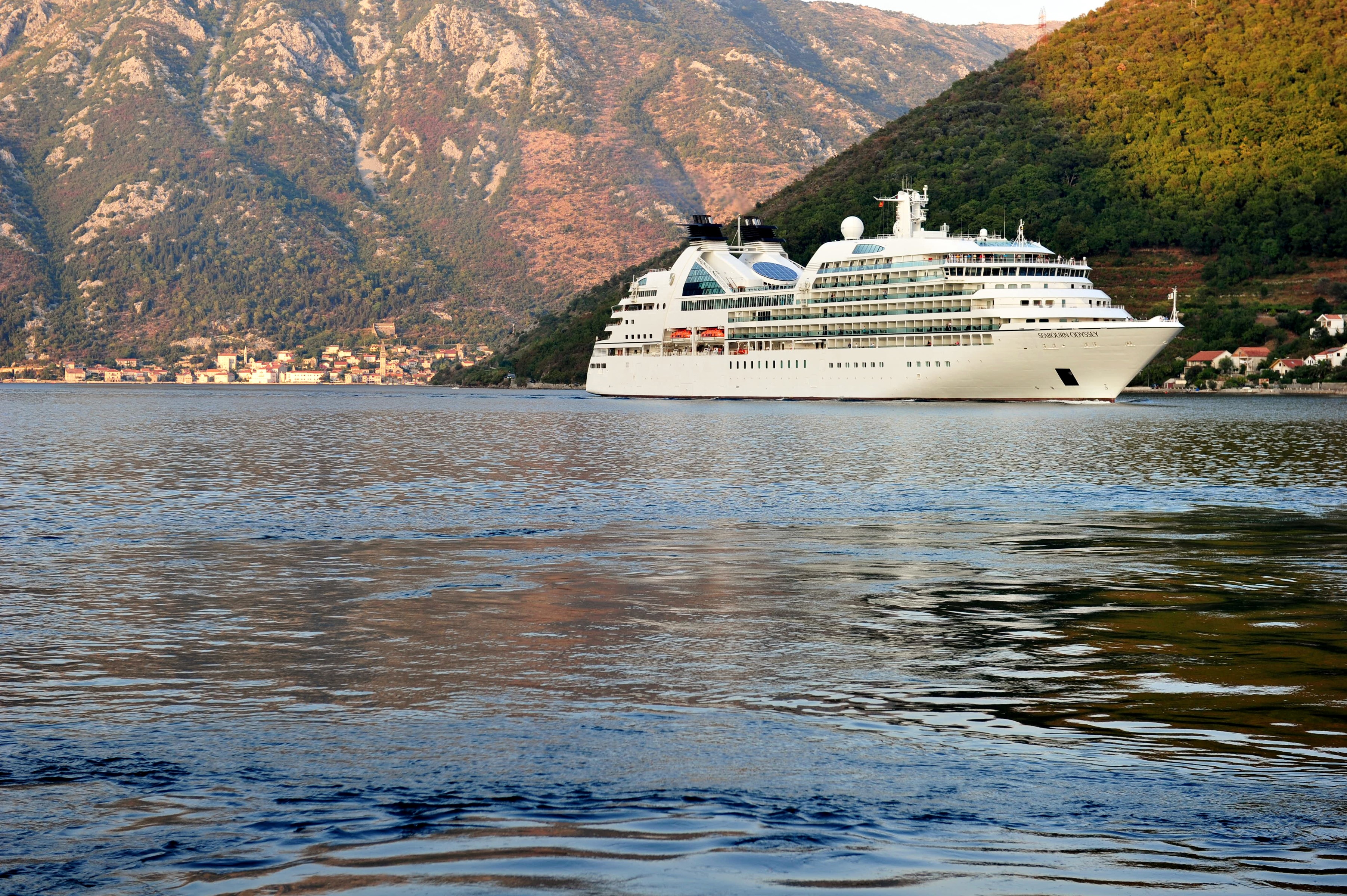 Cruise liner sailing on the sea near mountains in Montenegro HD Wallpaper