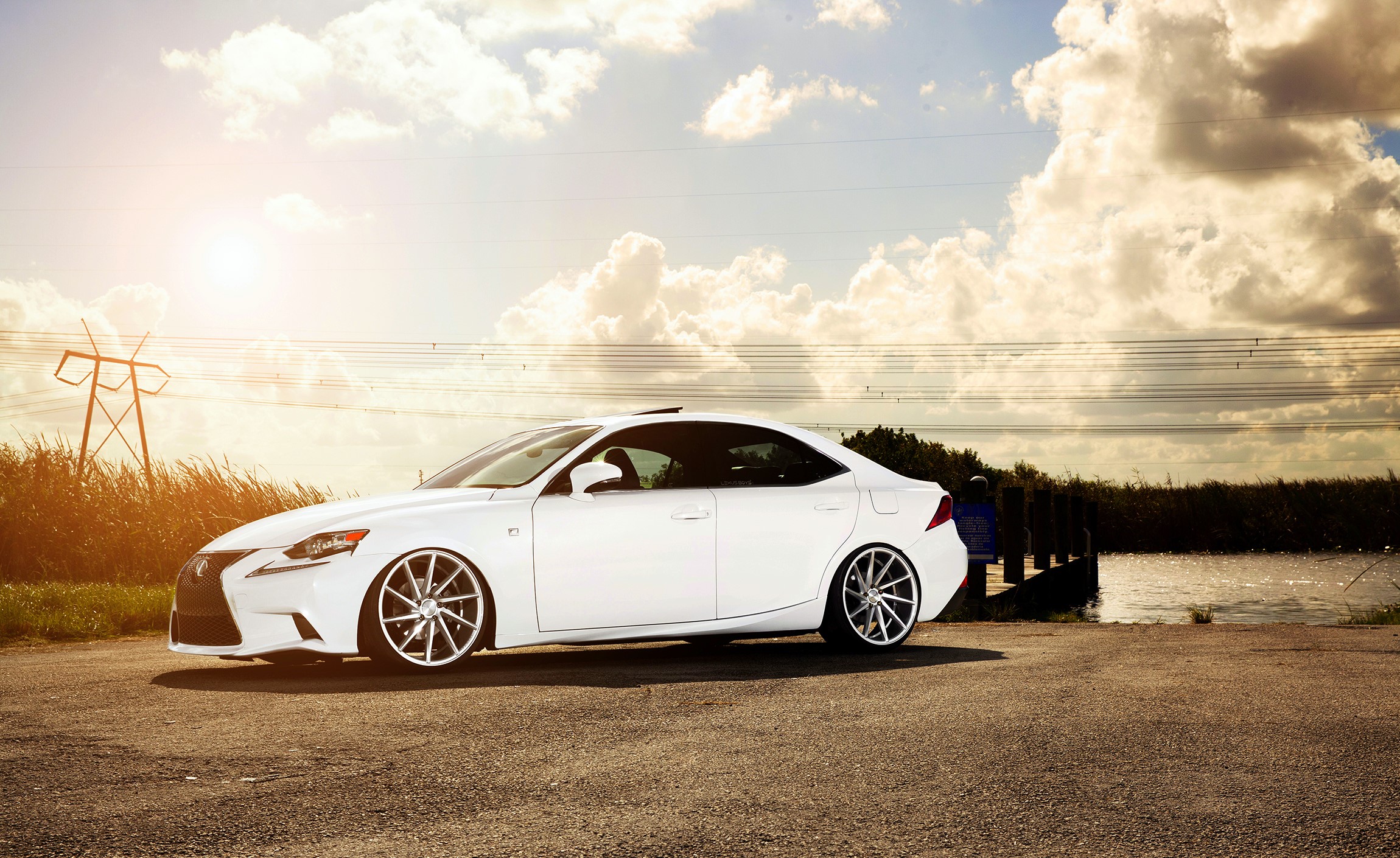 White Lexus IS F-sport parked by the water HD Wallpaper