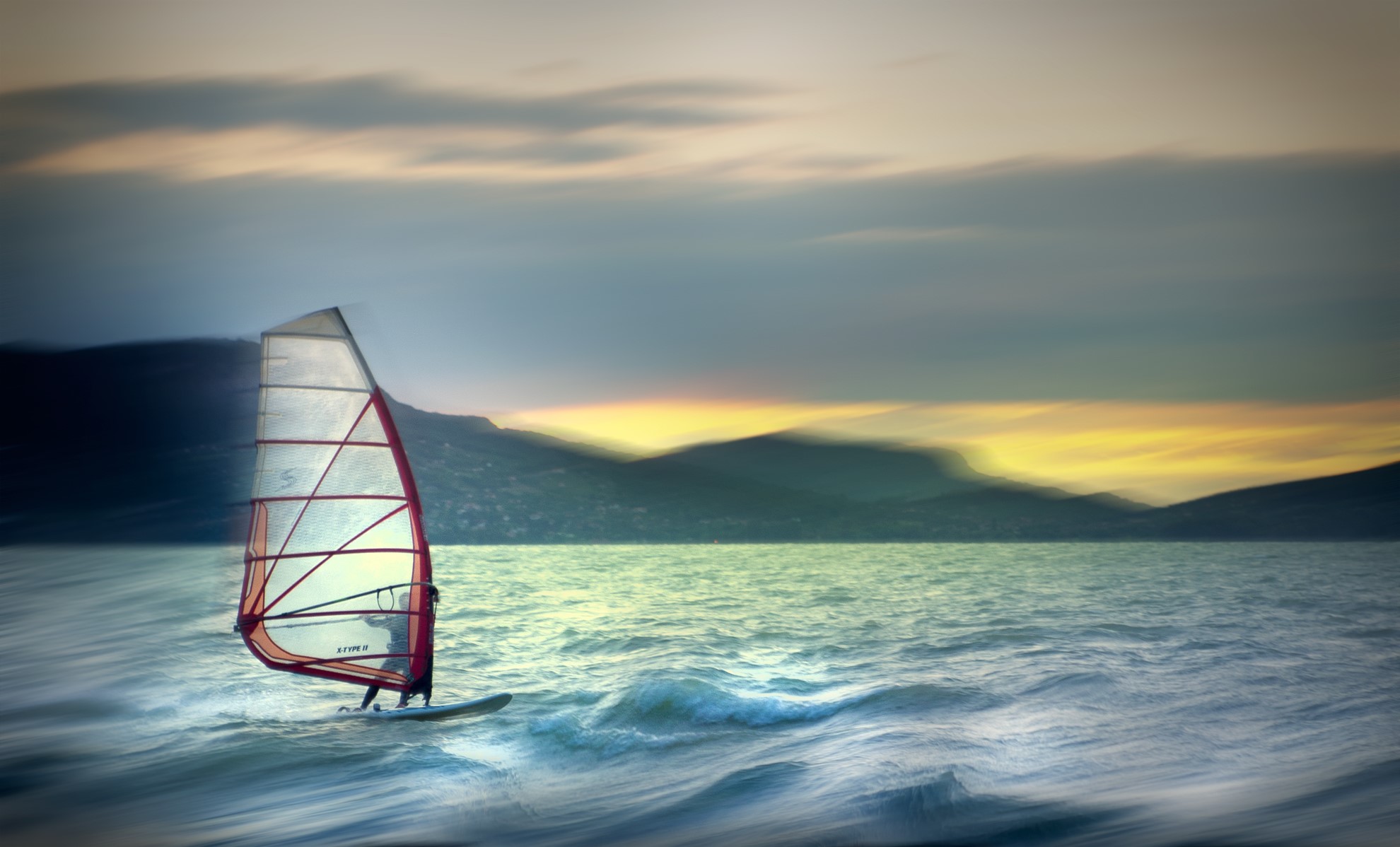 Windsurfer on a wavy sea at sunset HD Wallpaper