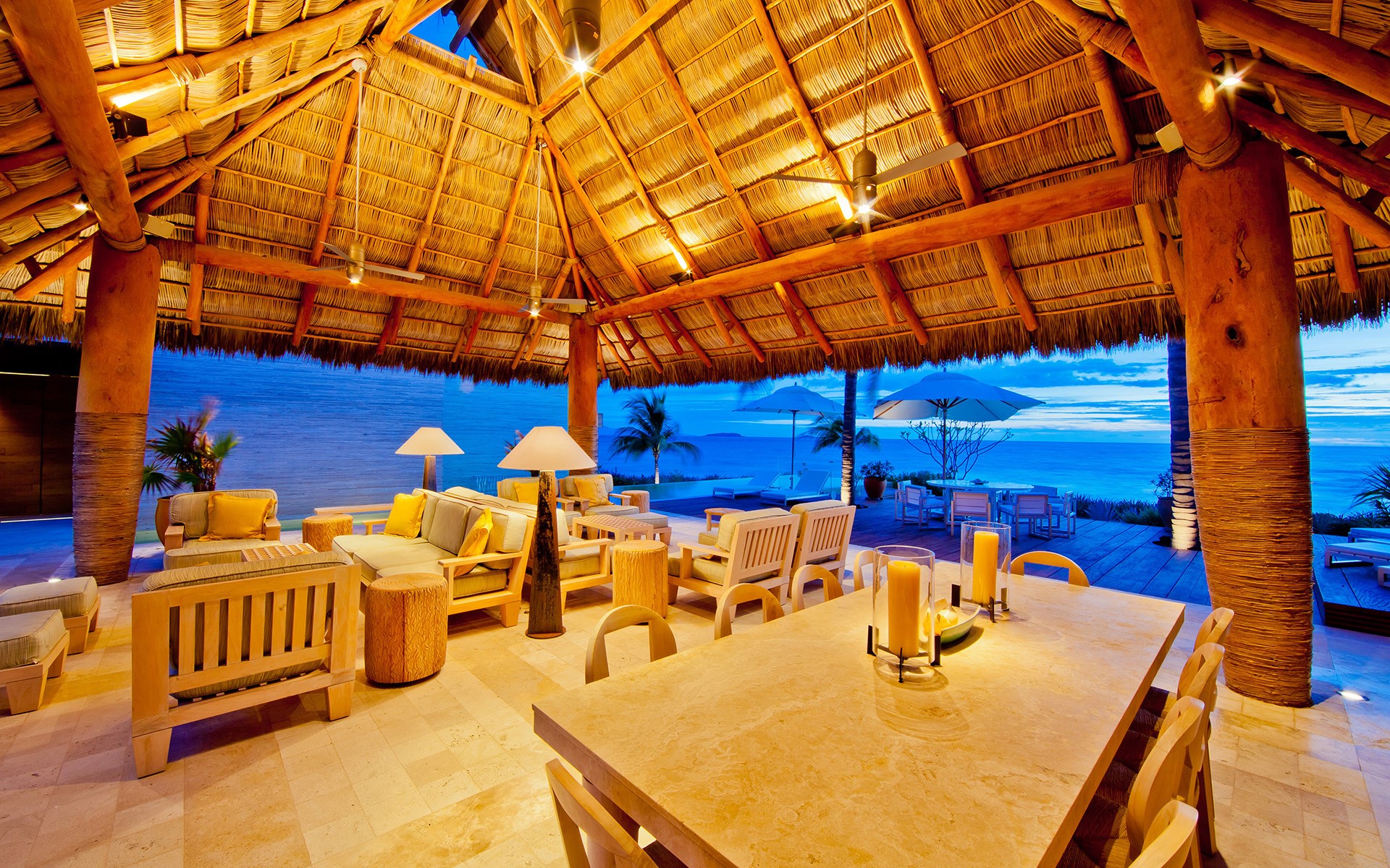 Luxury villa interior with ocean view at dusk HD Wallpaper
