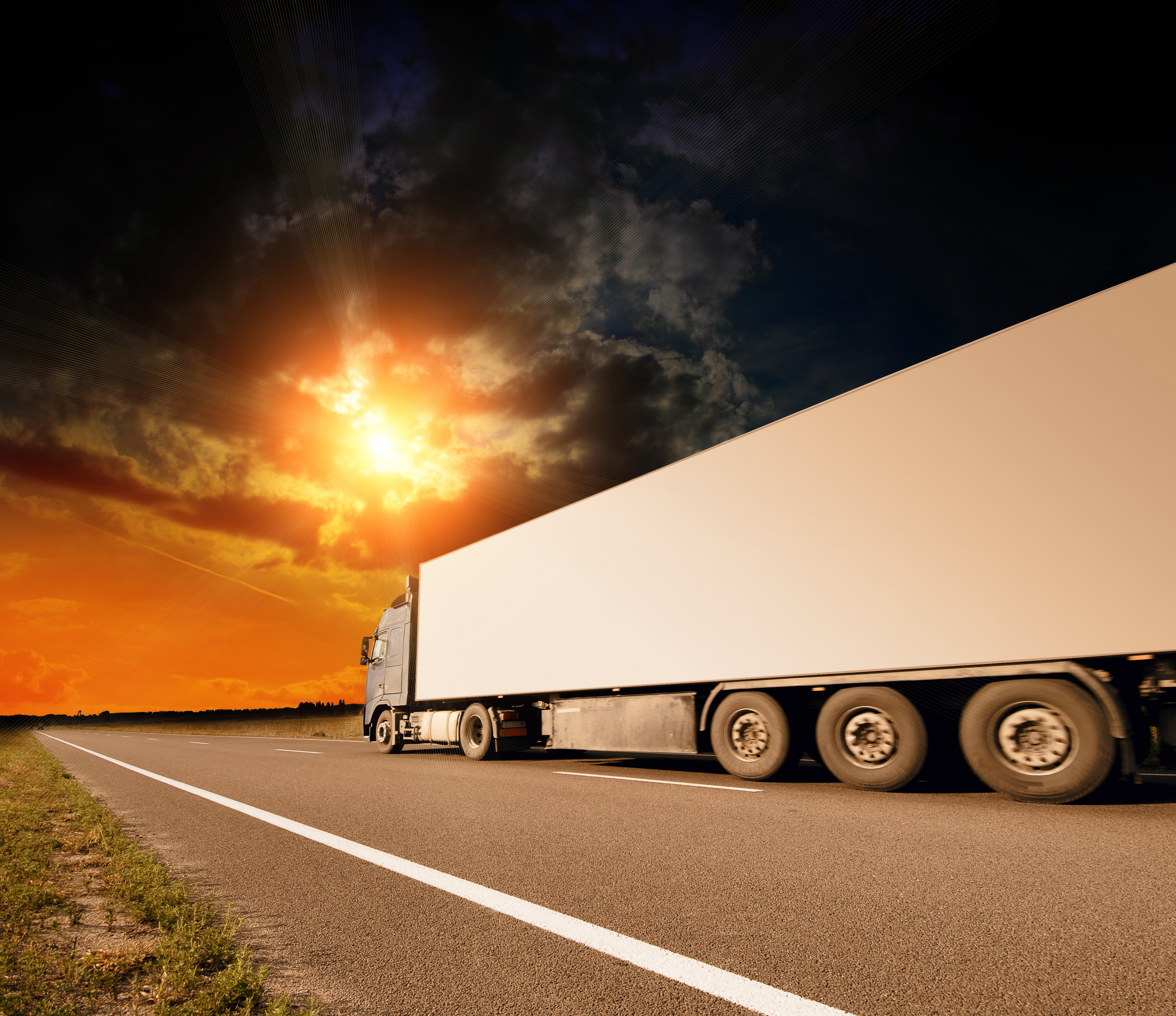 Truck on a highway at sunset HD Wallpaper