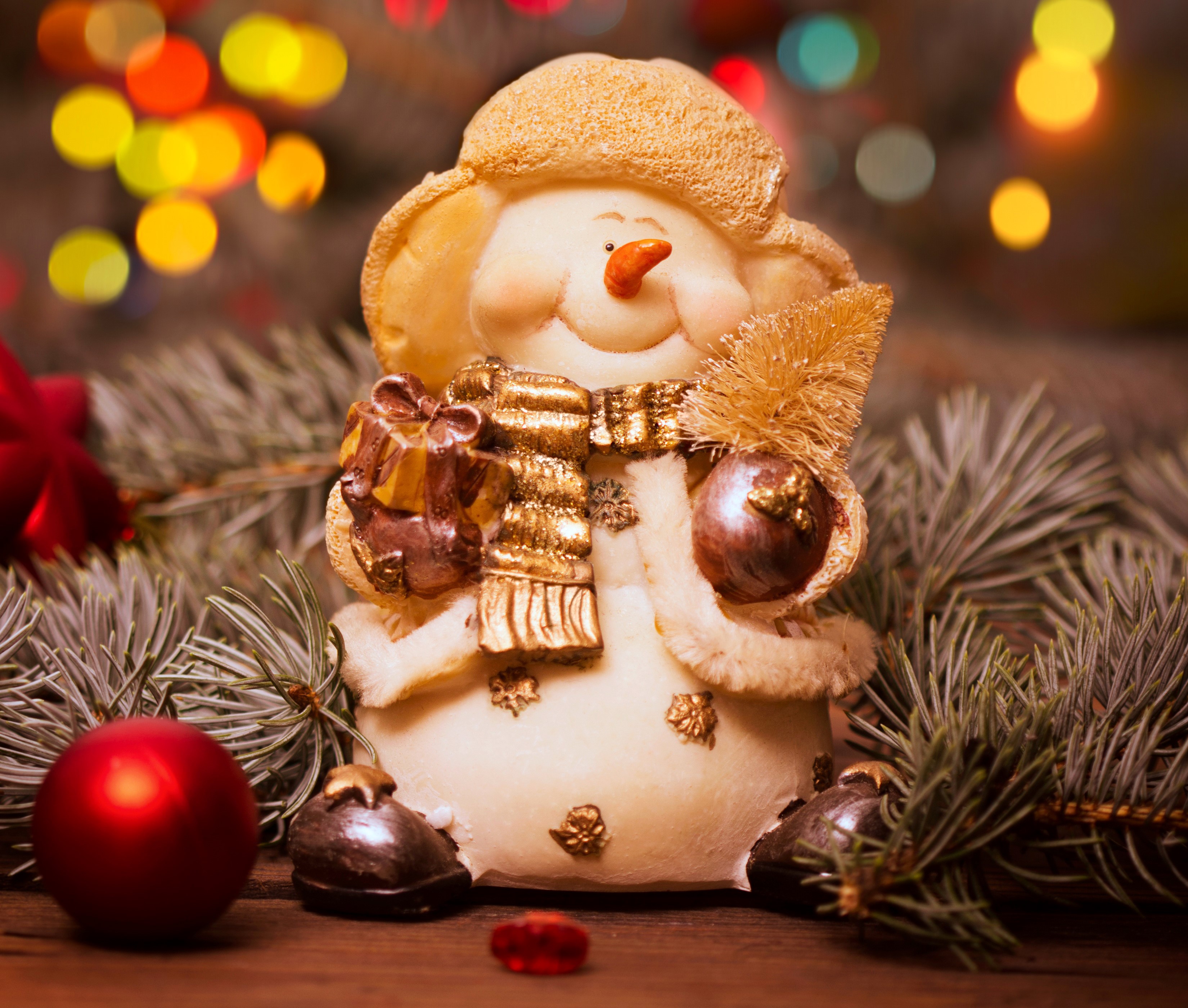 Christmas snowman figurine with gifts and ornaments HD Wallpaper