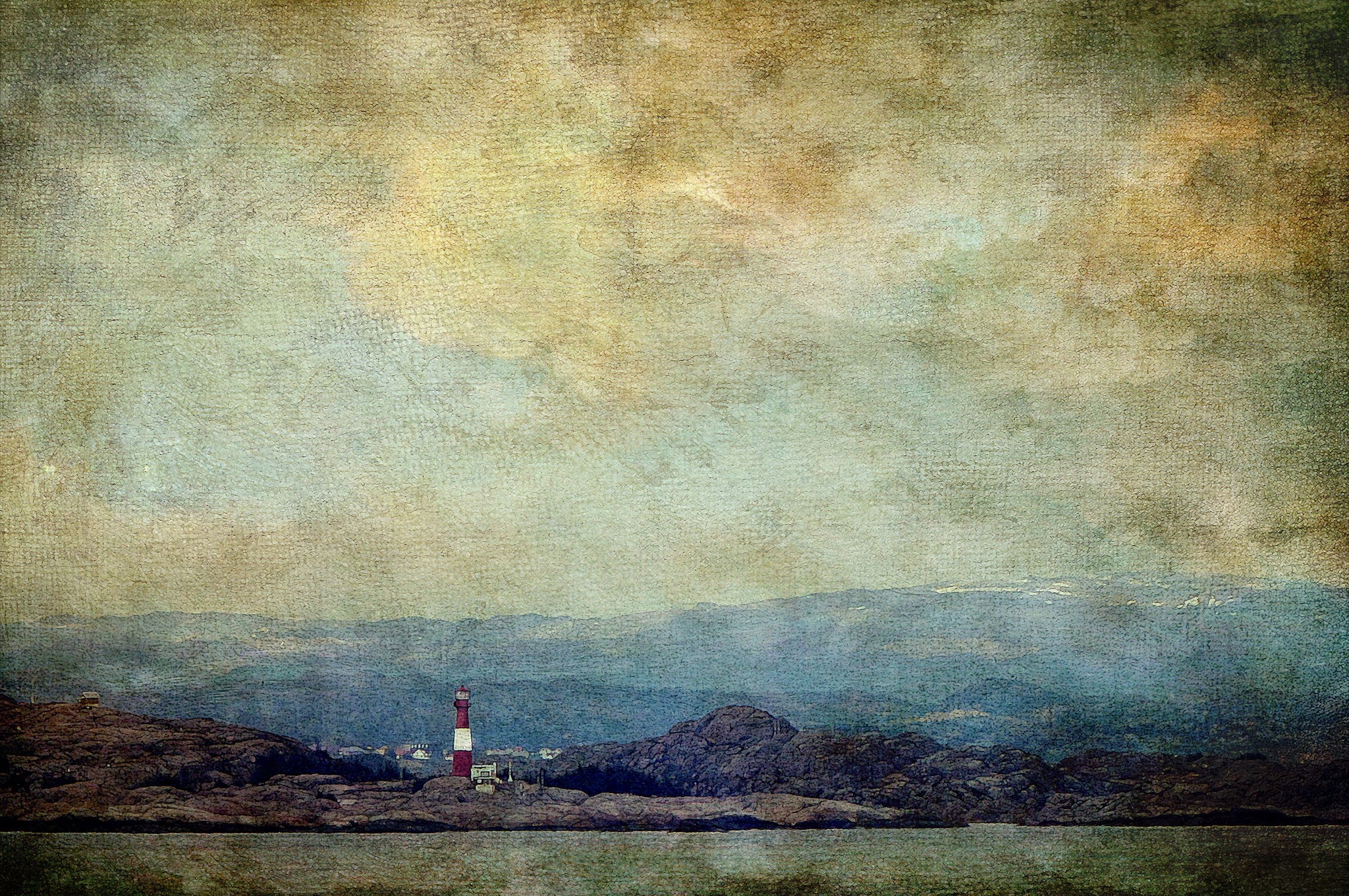 Lighthouse on a rocky shore with distant hills HD Wallpaper