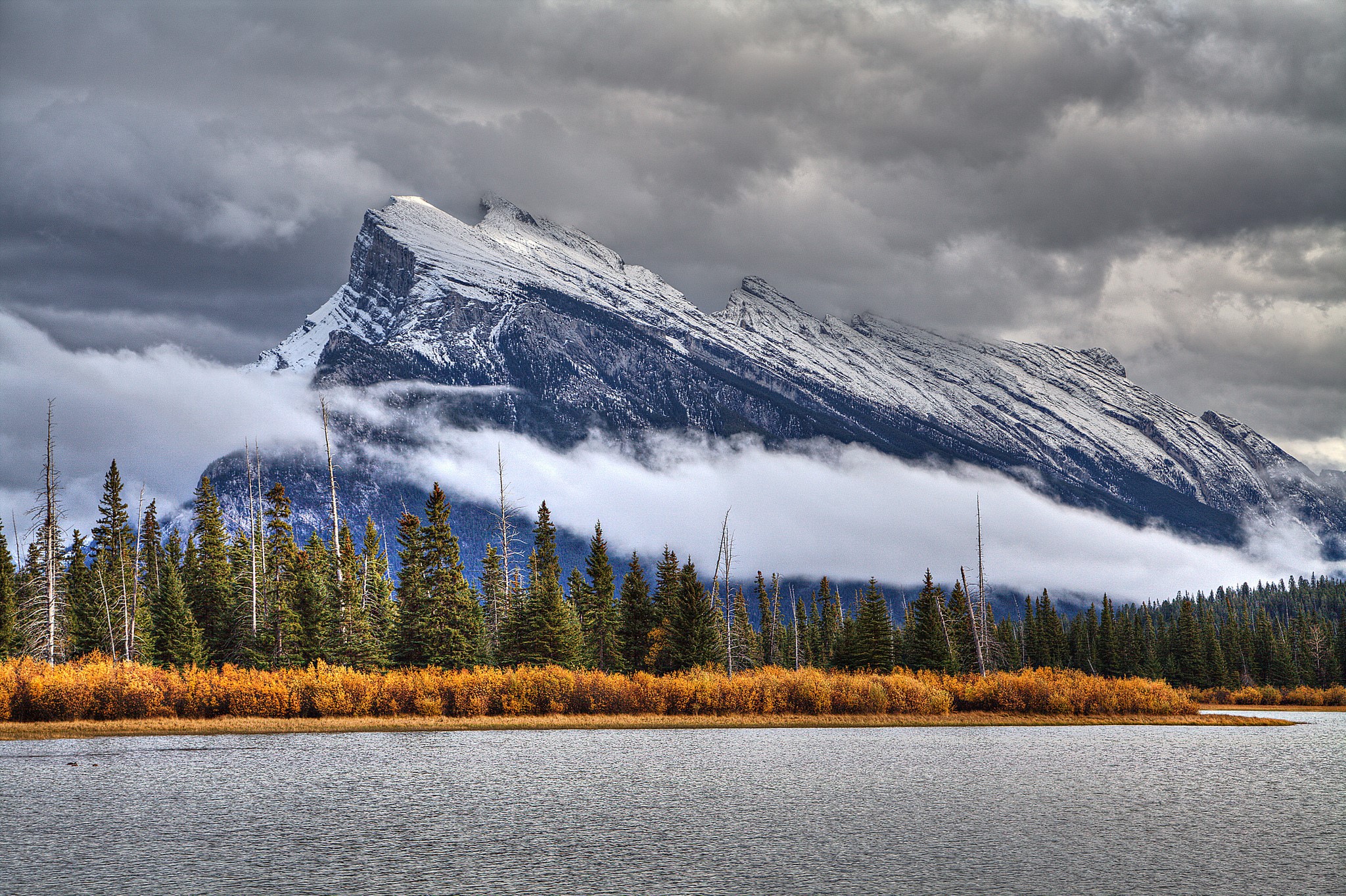 Snow-capped mountains over a lake and forest HD Wallpaper