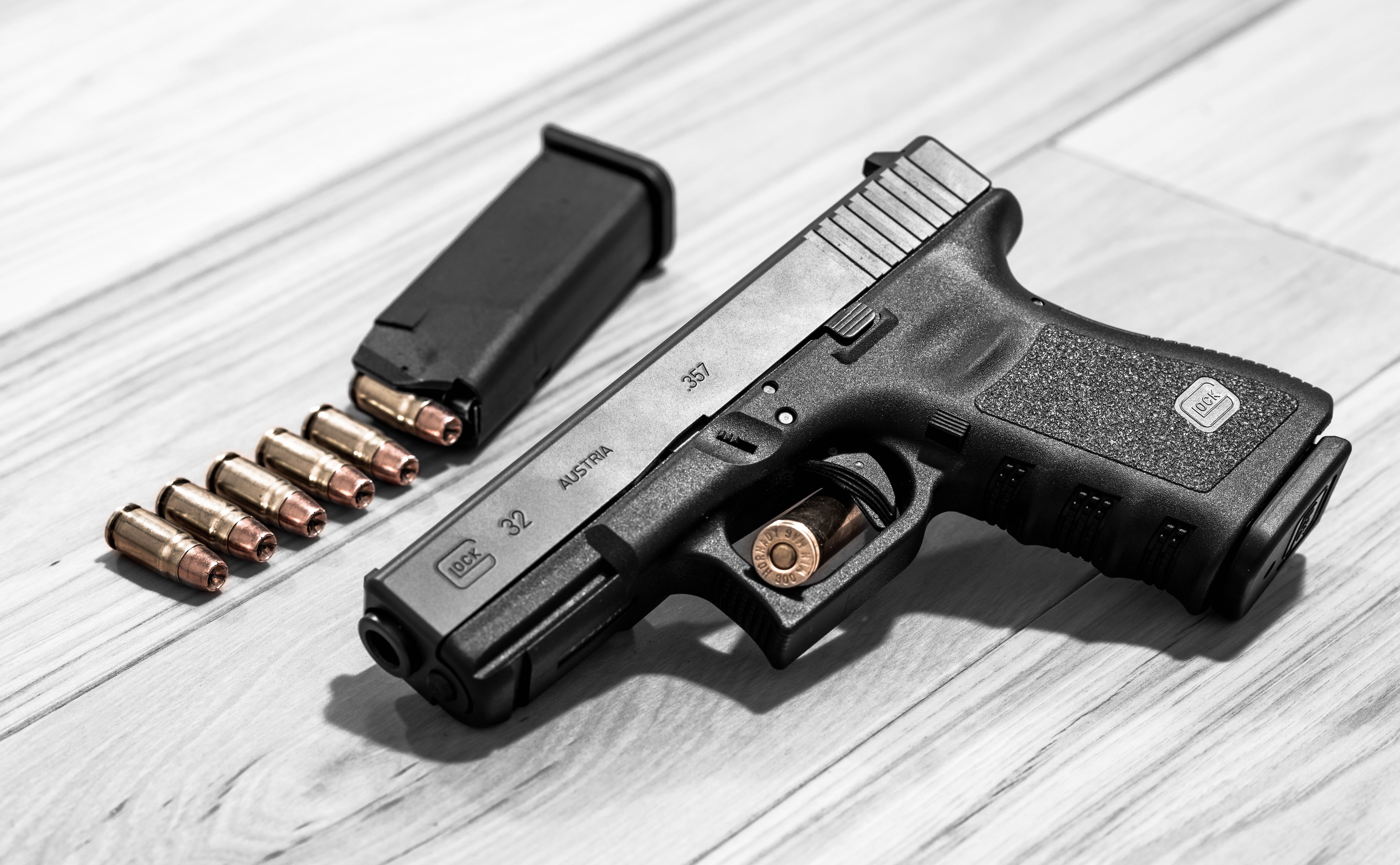 Glock 32 pistol with magazine and cartridges HD Wallpaper