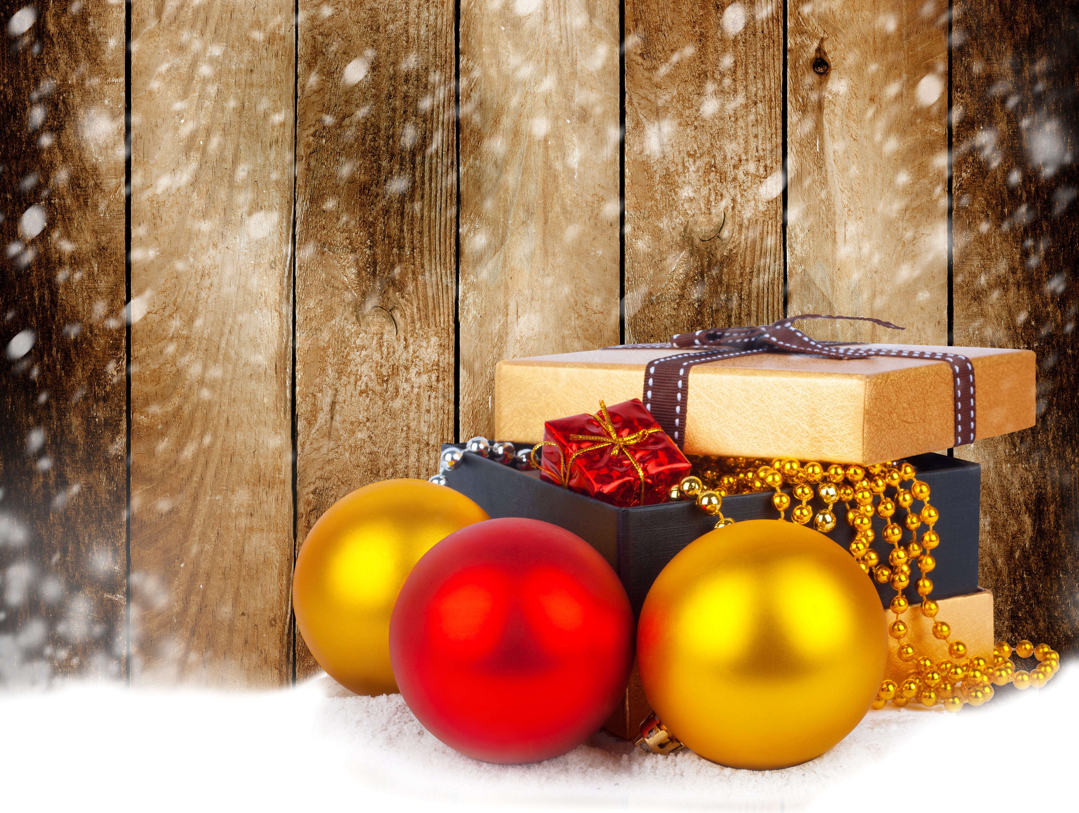 Christmas Gifts and Ornaments on Wood Planks with Snow HD Wallpaper