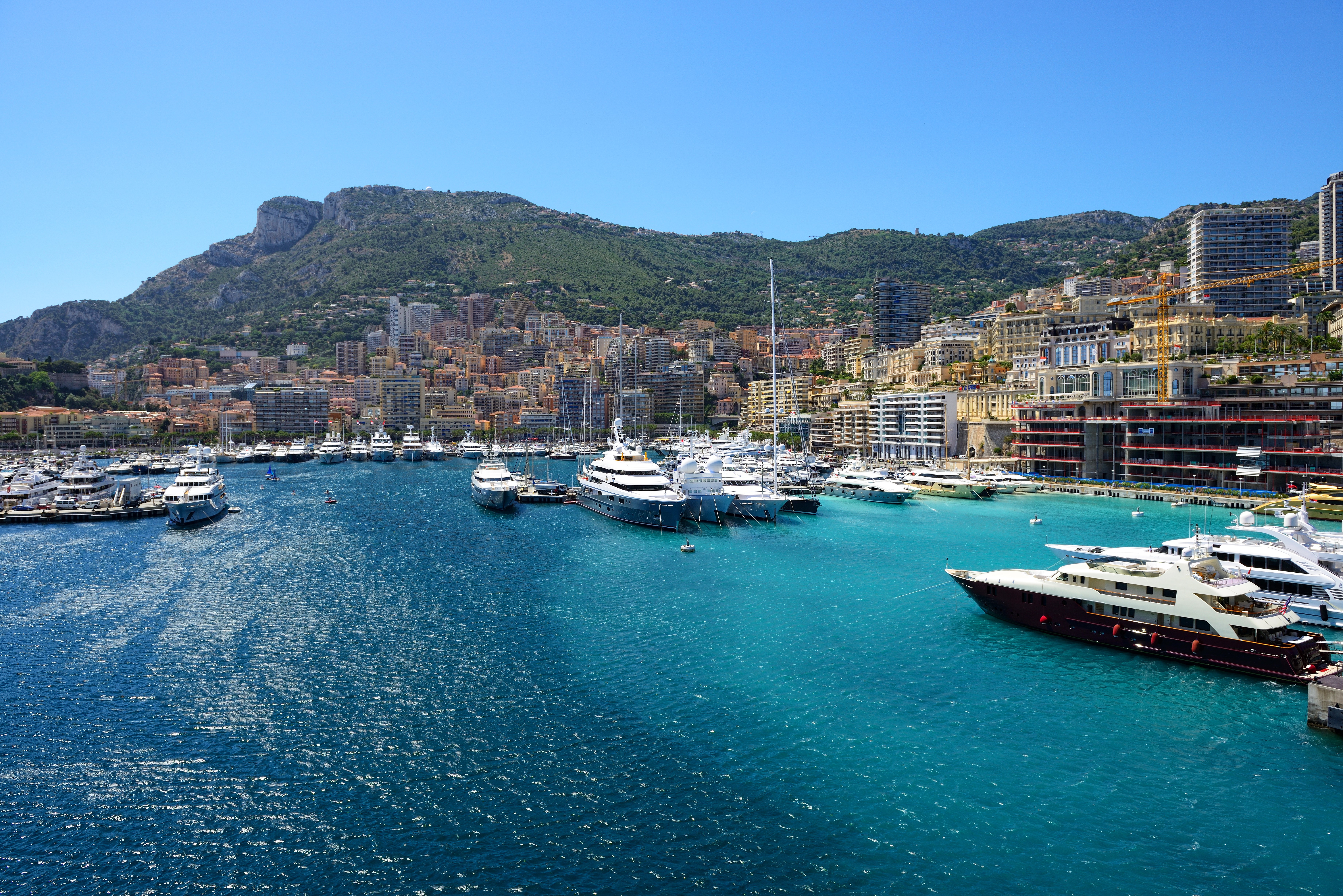 Yachts in Monaco Harbor with Mountains and Cityscape HD Wallpaper