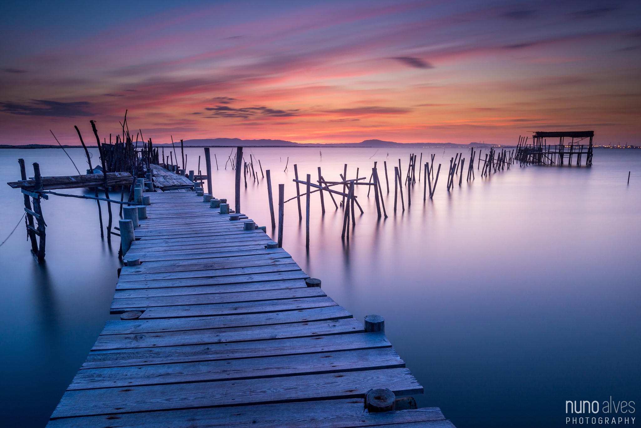 Wooden pier on a calm sea at sunset in Portugal HD Wallpaper