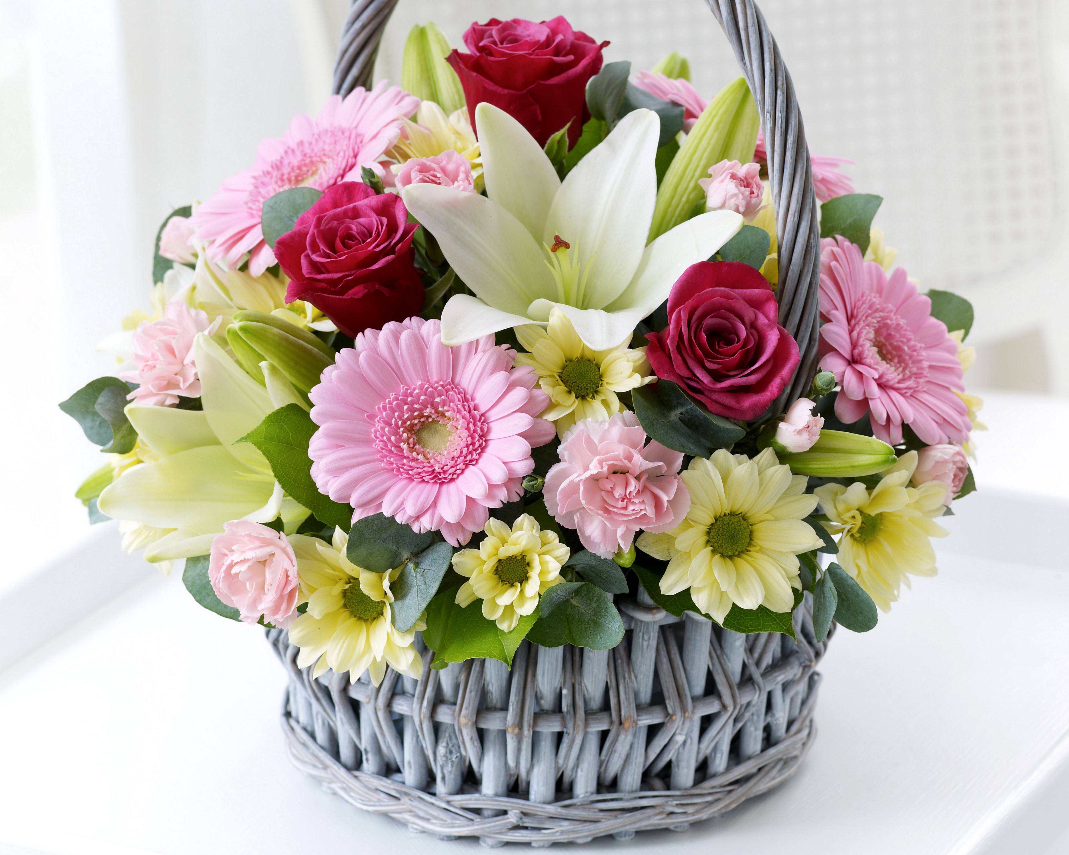 Flower basket with roses, gerberas, lilies, and carnations HD Wallpaper