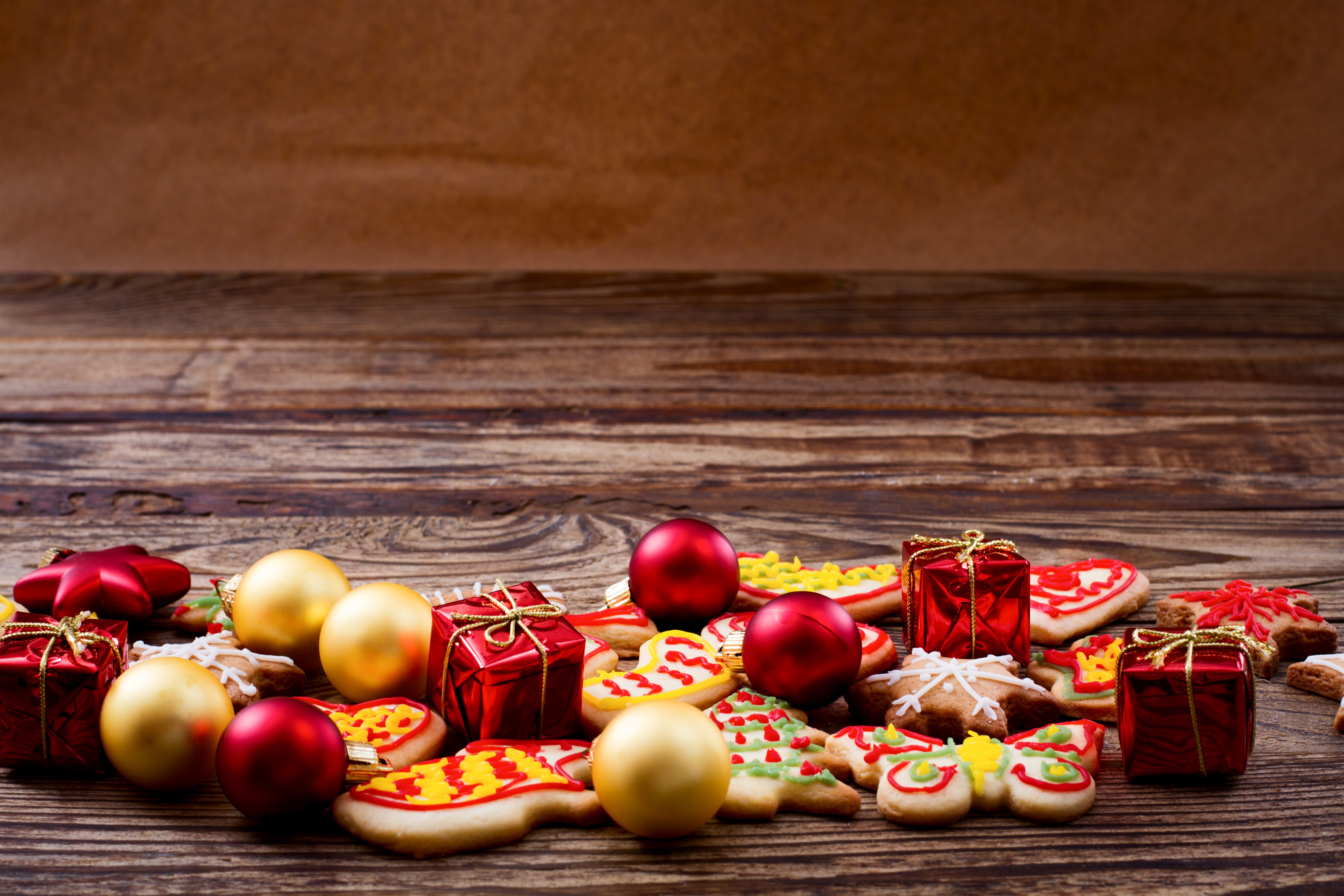 Christmas cookies and ornaments on wooden table HD Wallpaper