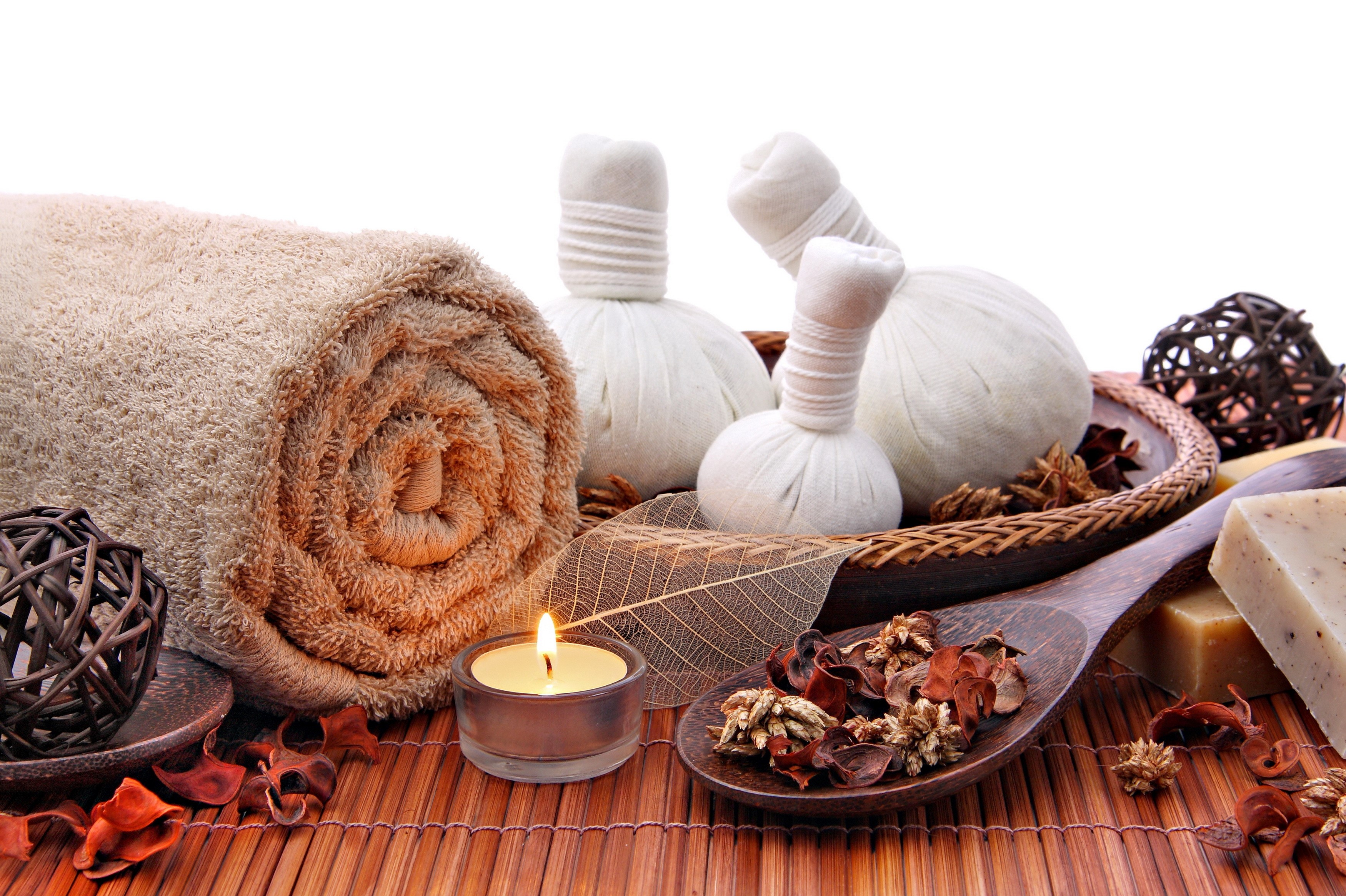 Spa items with rolled towel, candle, and soap HD Wallpaper