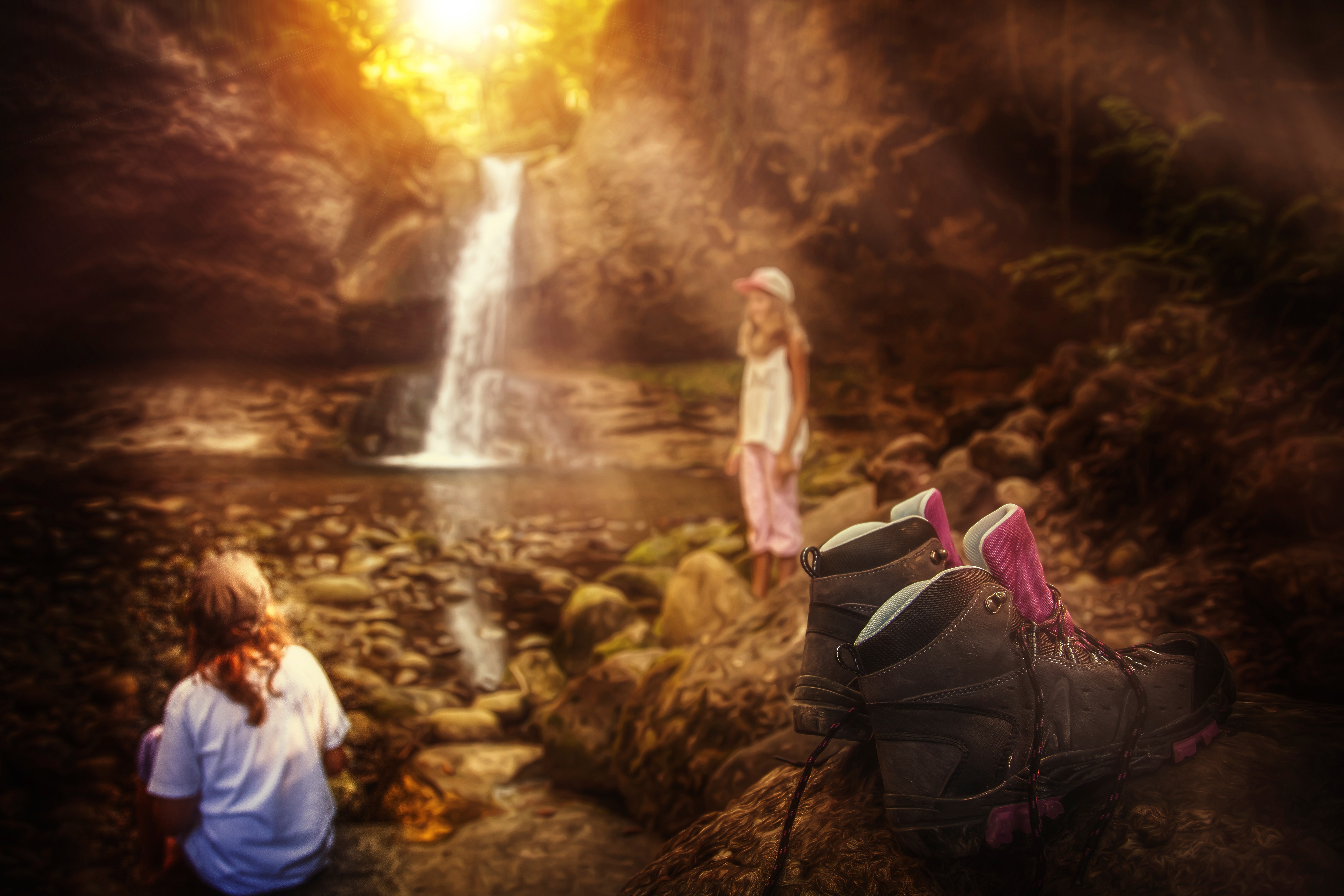 Two girls and boots by a waterfall HD Wallpaper
