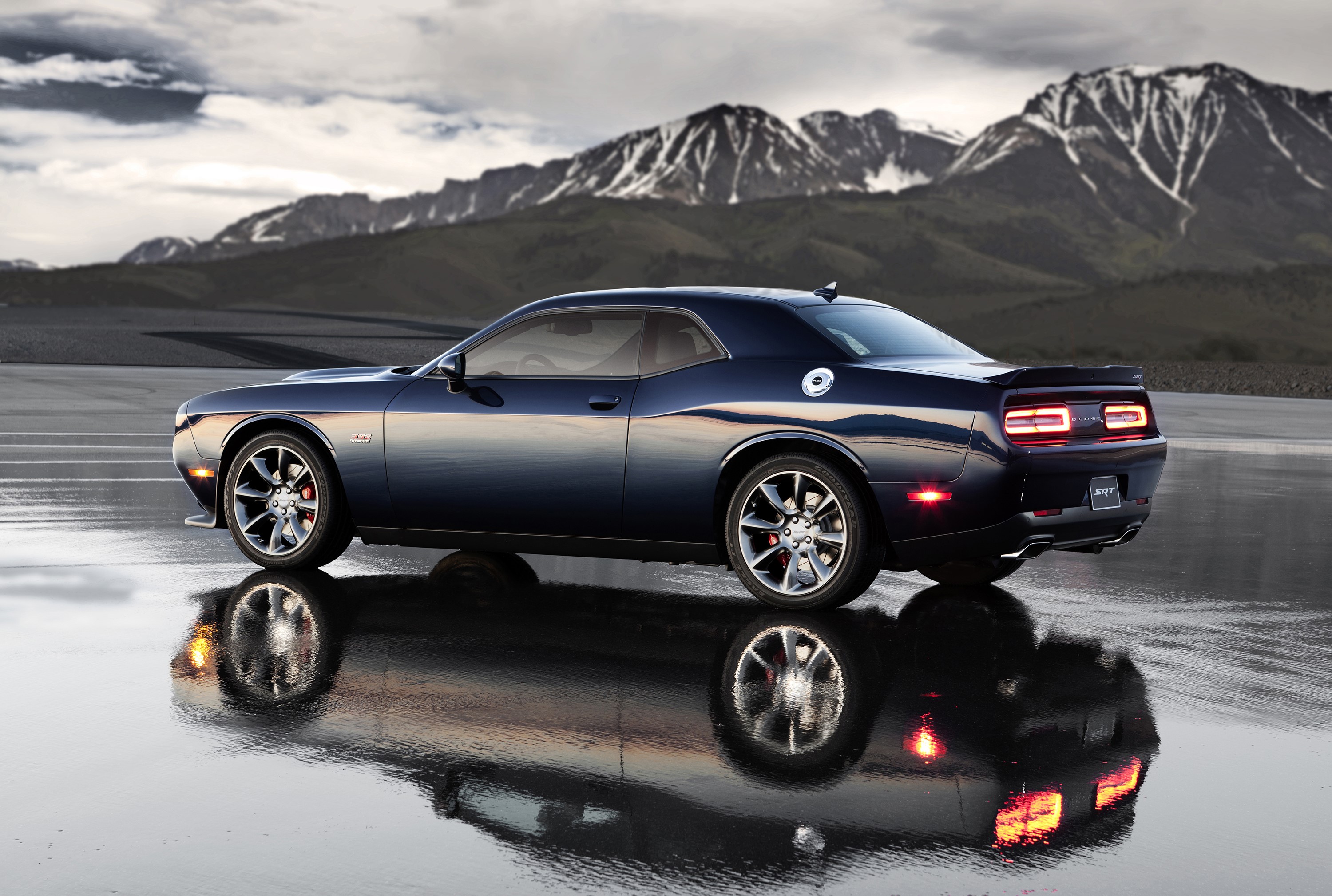 Blue Dodge Challenger SRT Hellcat on wet road with mountains HD Wallpaper
