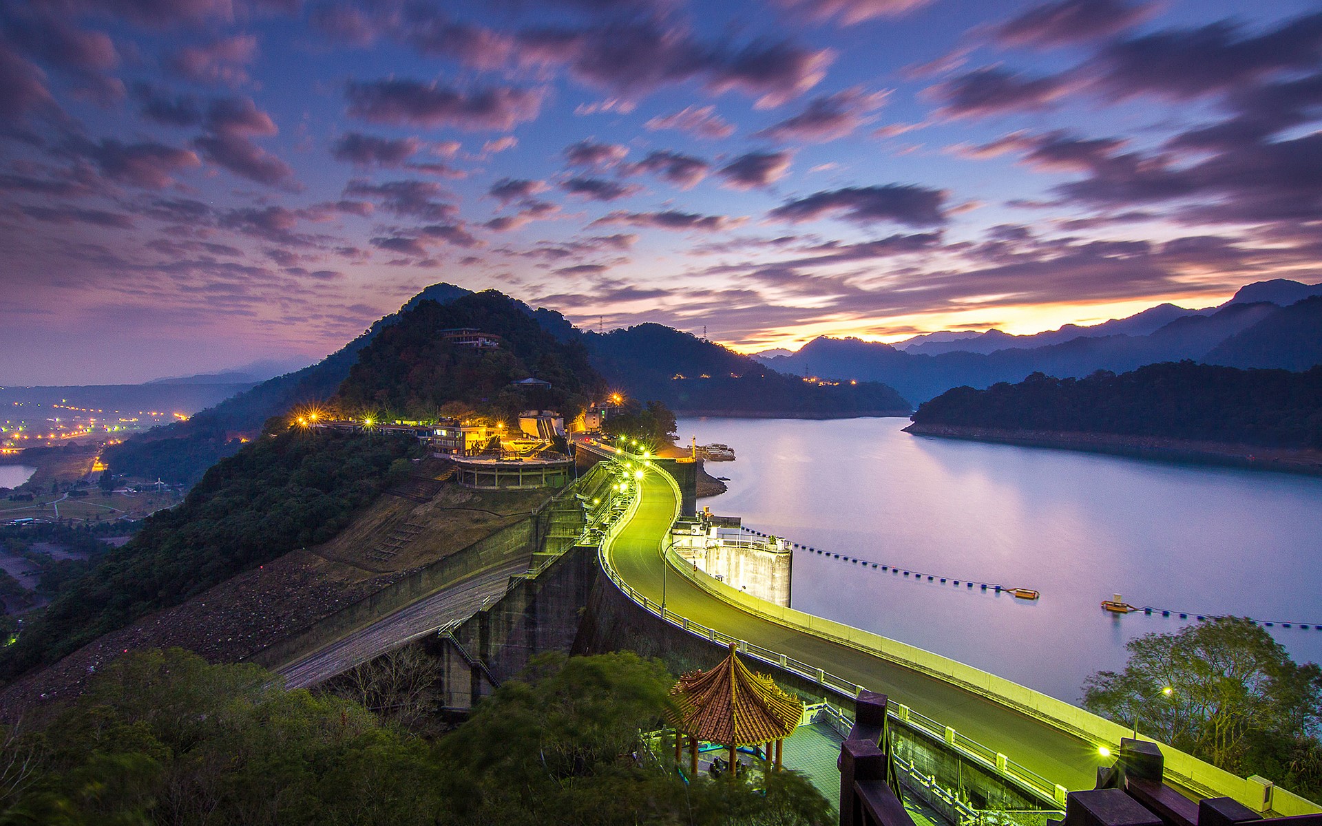 Dam and lake at sunset with mountains and clouds HD Wallpaper