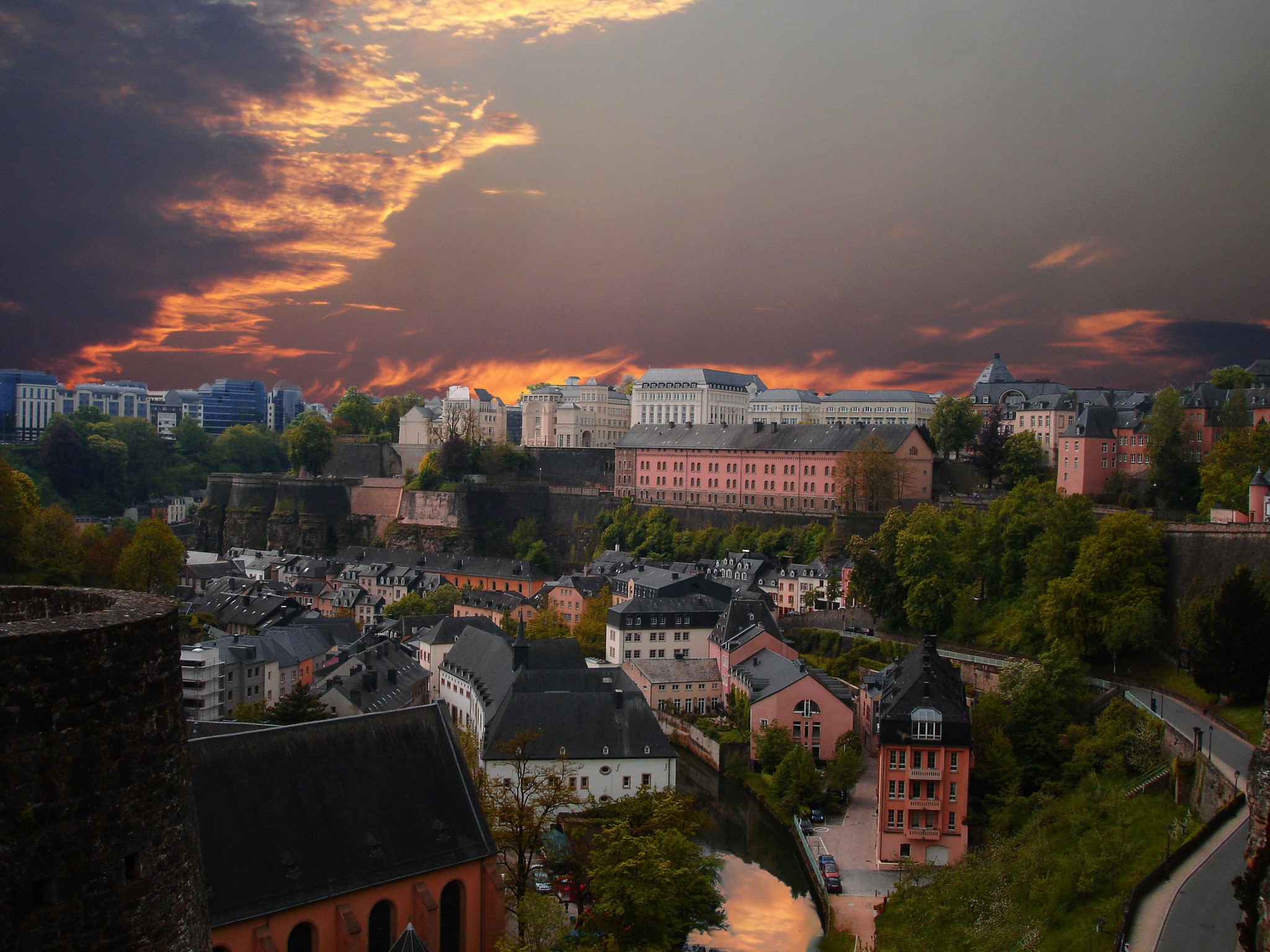 Luxembourg cityscape with historic buildings and dramatic sky HD Wallpaper