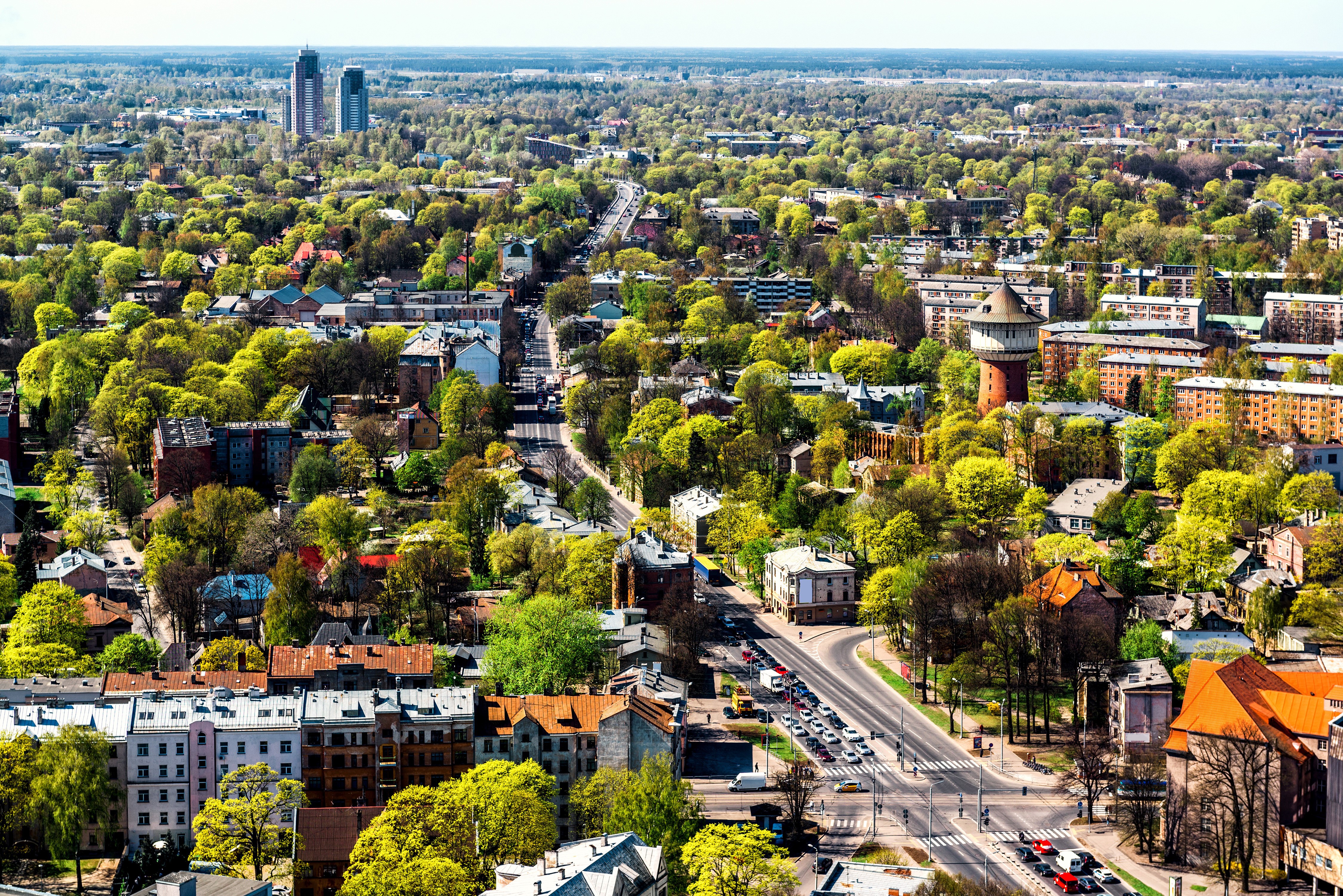 Aerial view of Riga, Latvia with houses and trees HD Wallpaper