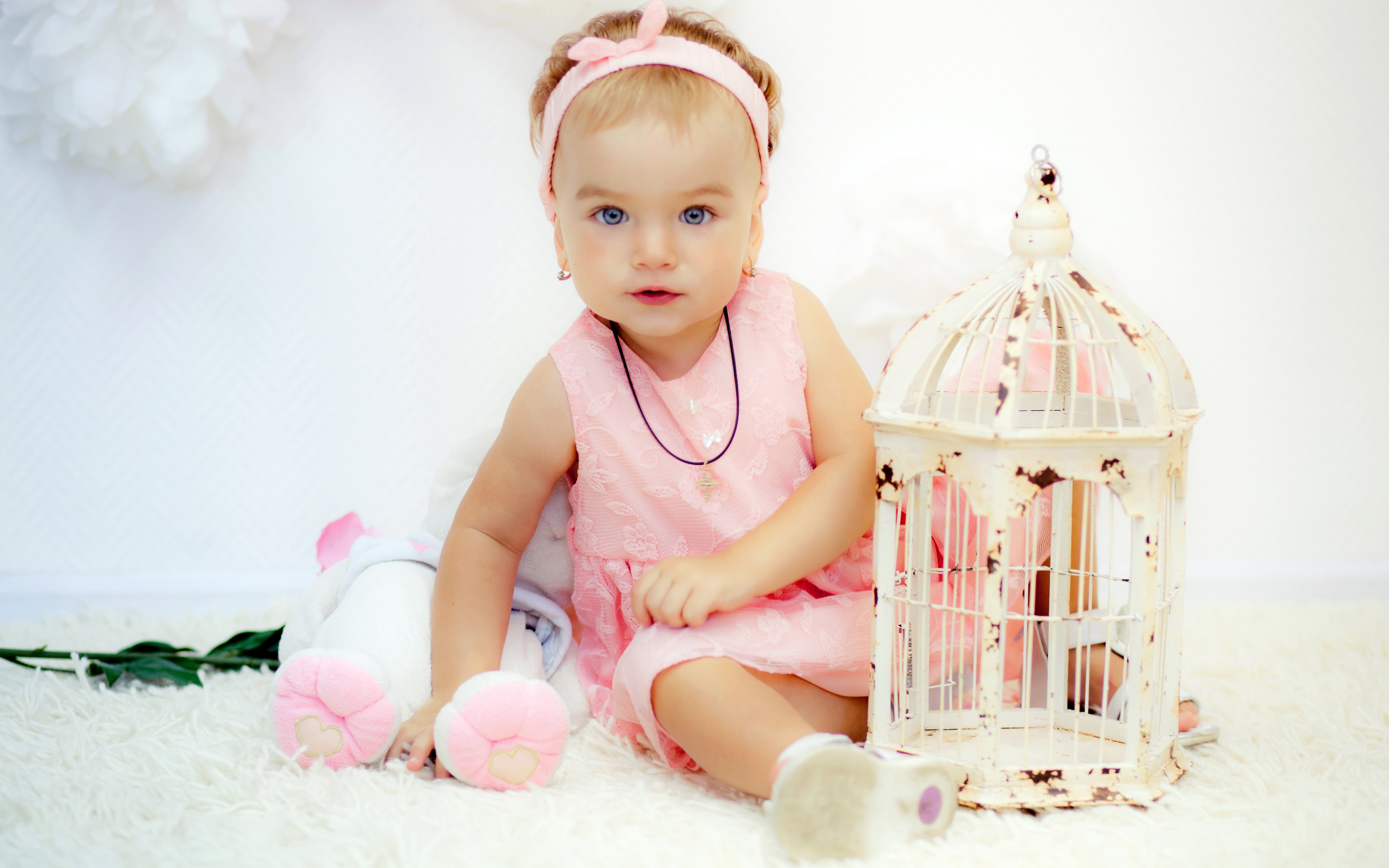 Little girl in pink dress with birdcage HD Wallpaper