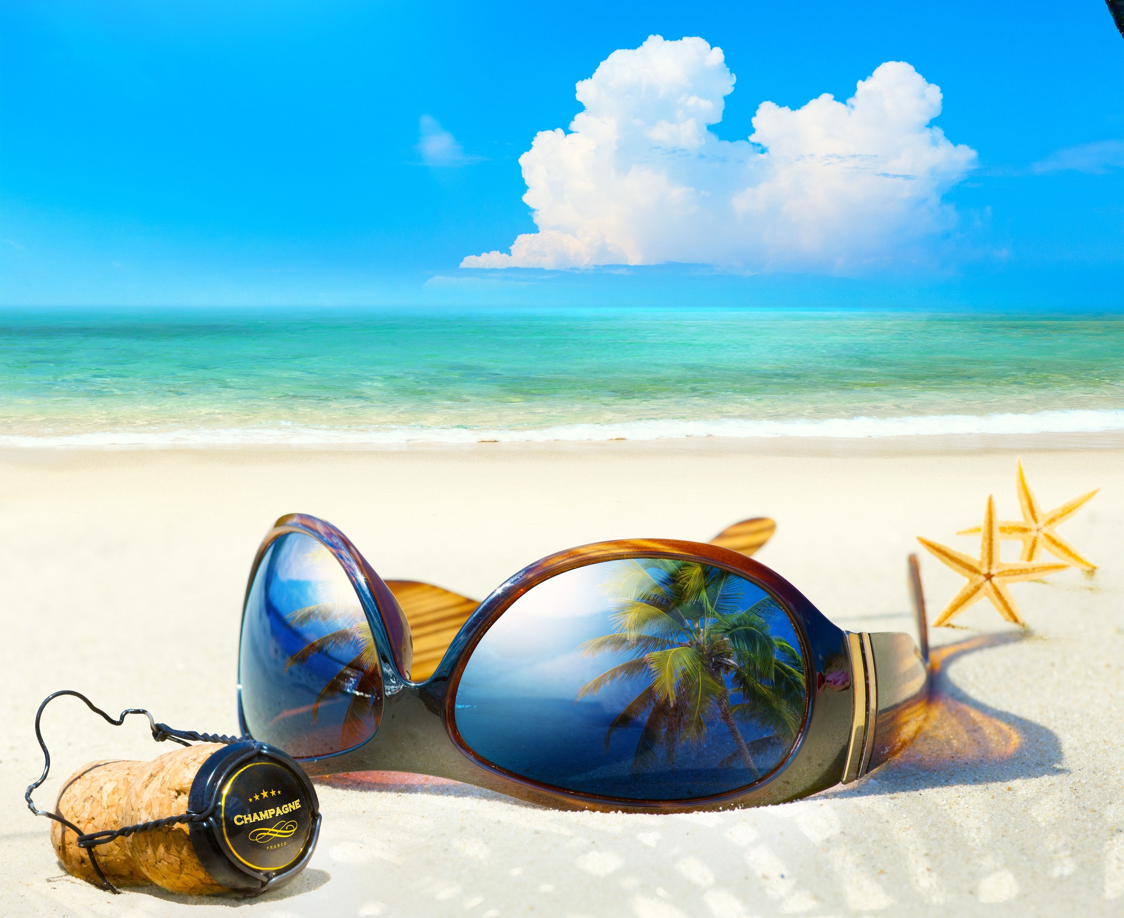Summer beach scene with sunglasses and champagne cork HD Wallpaper