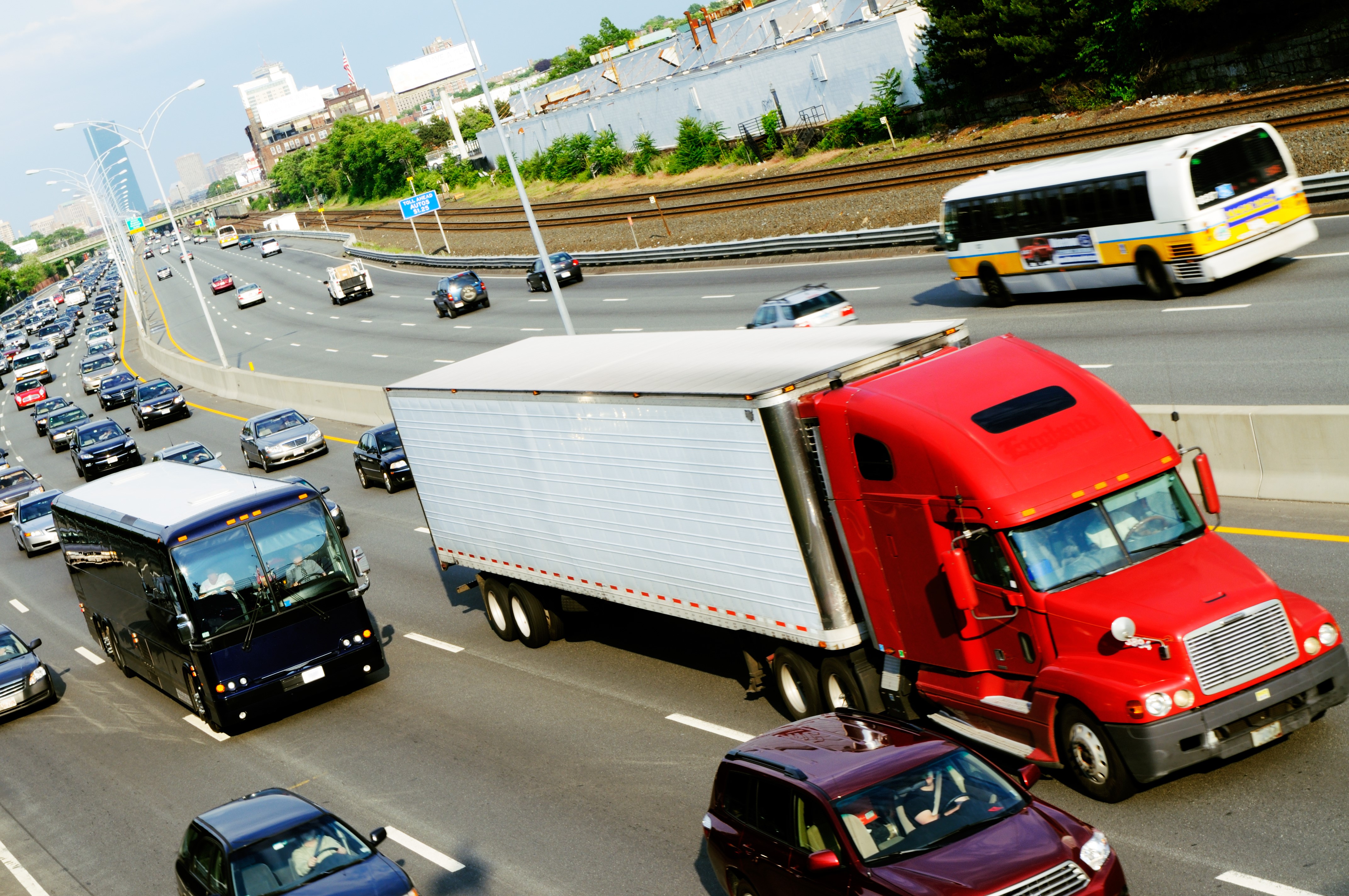 Red Semi-Truck and Bus on Highway HD Wallpaper
