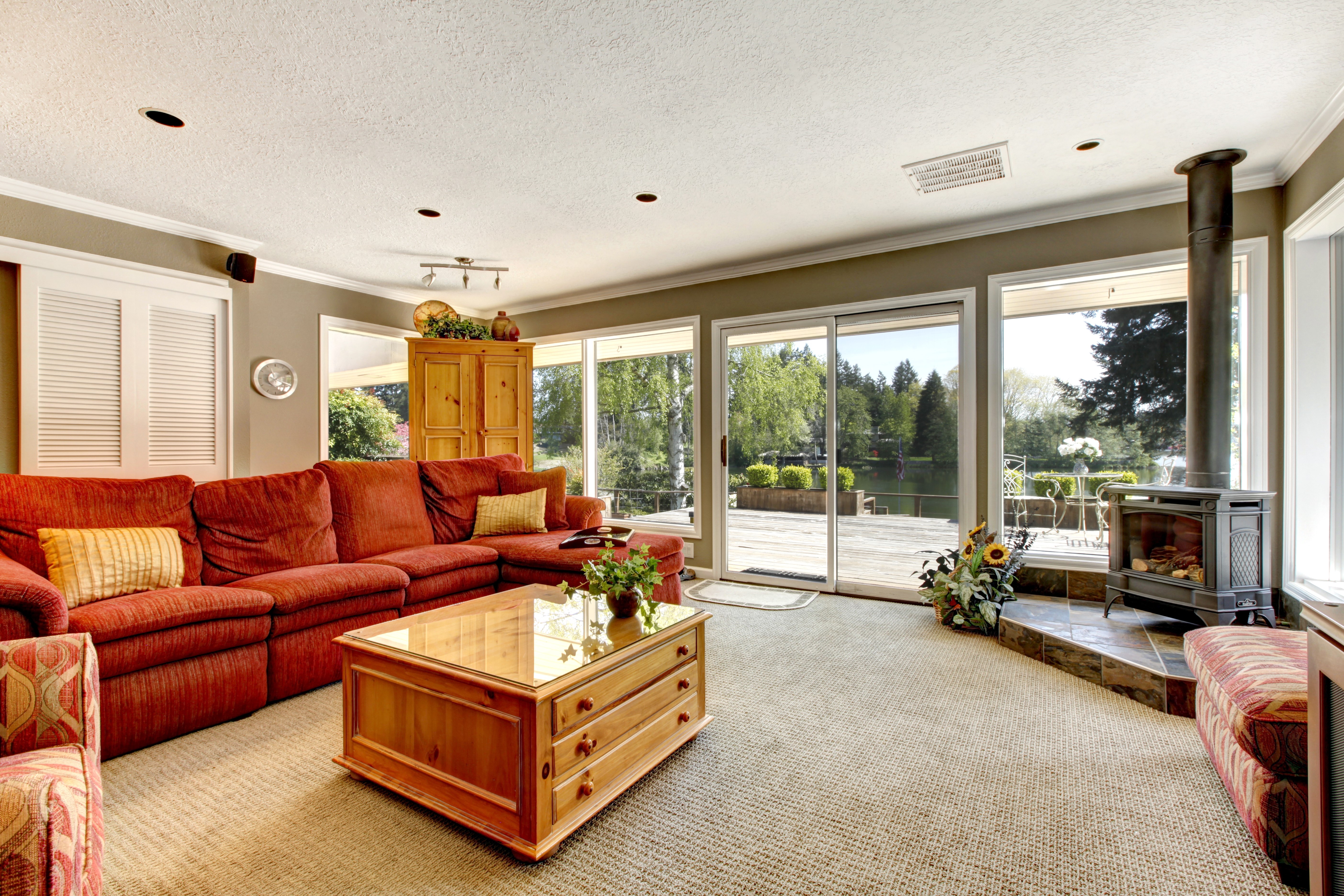 Living room with red sofa and fireplace HD Wallpaper