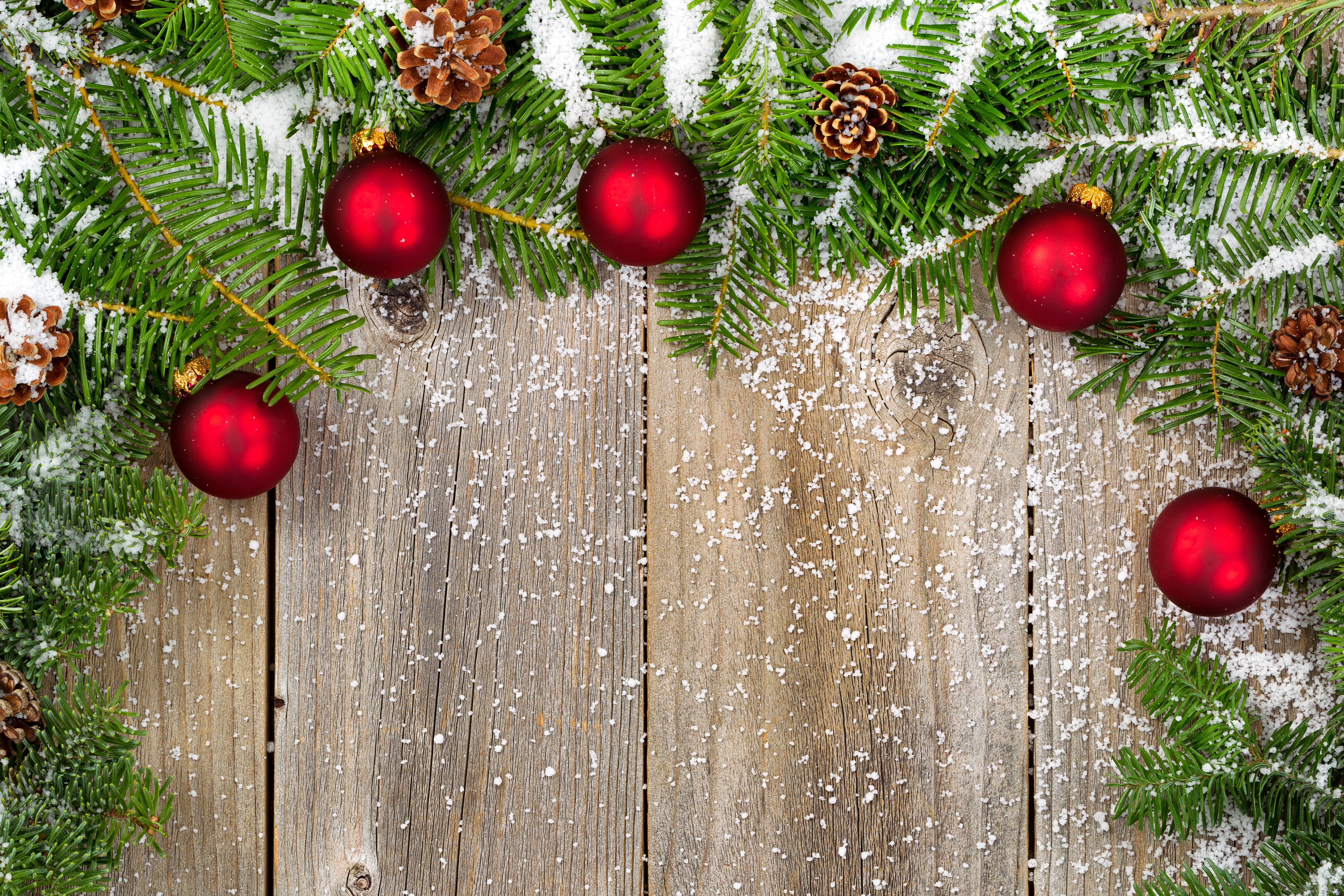 Christmas Branches with Red Ornaments and Pine Cones on Wood HD Wallpaper