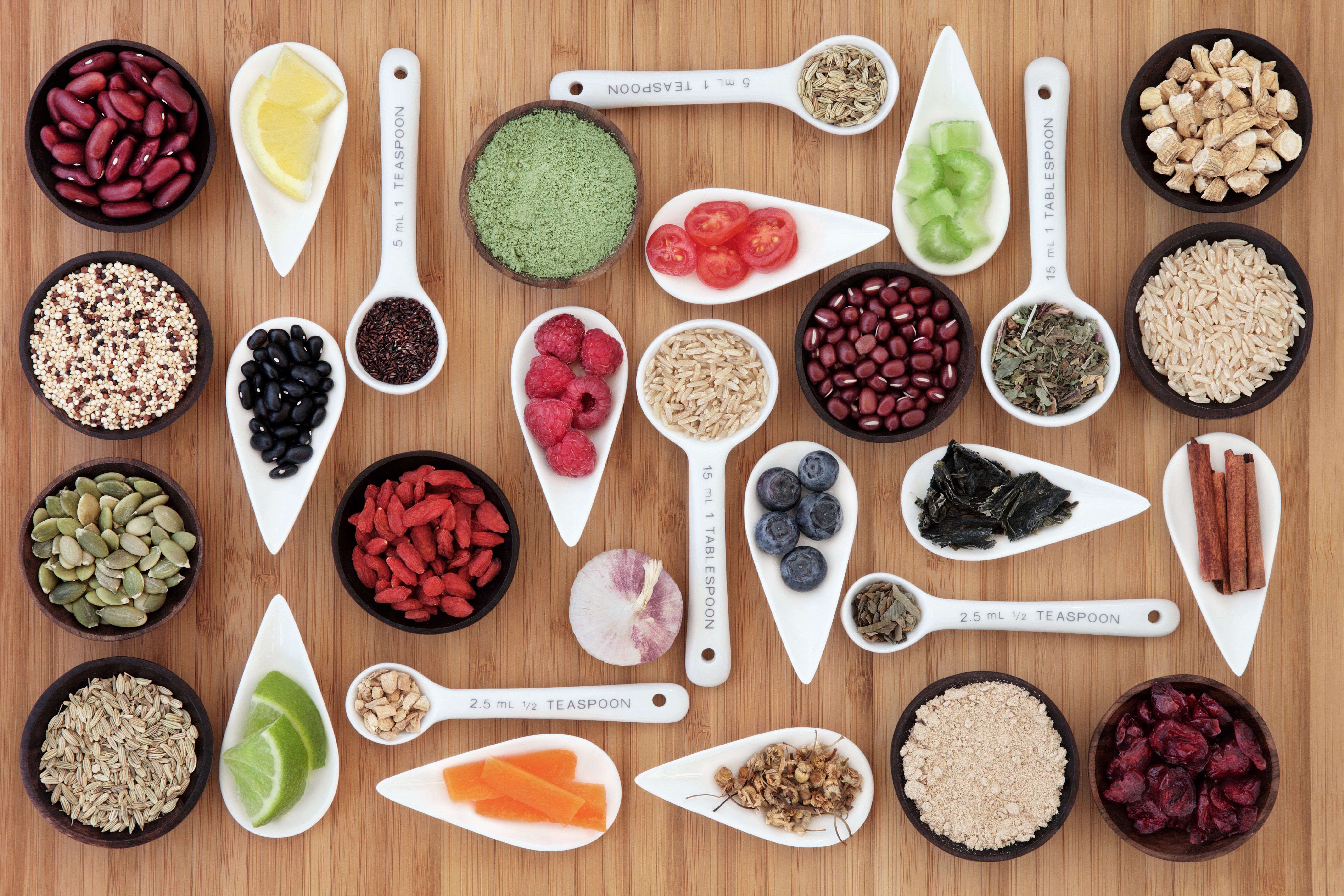 Assortment of Healthy Foods and Spices on Wooden Background HD Wallpaper
